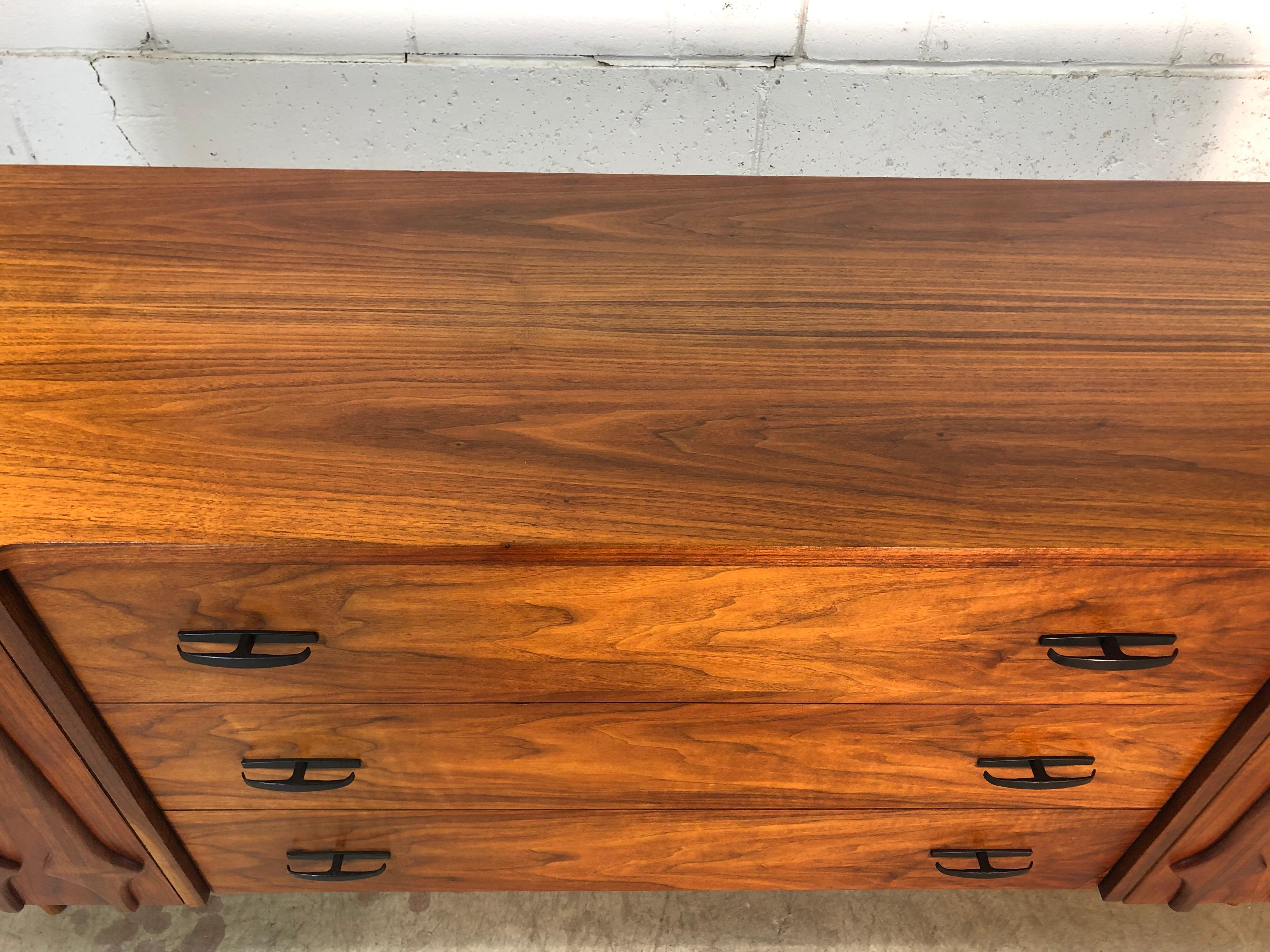 20th Century 1960s Sculpted Walnut Long Nine Drawer Dresser For Sale