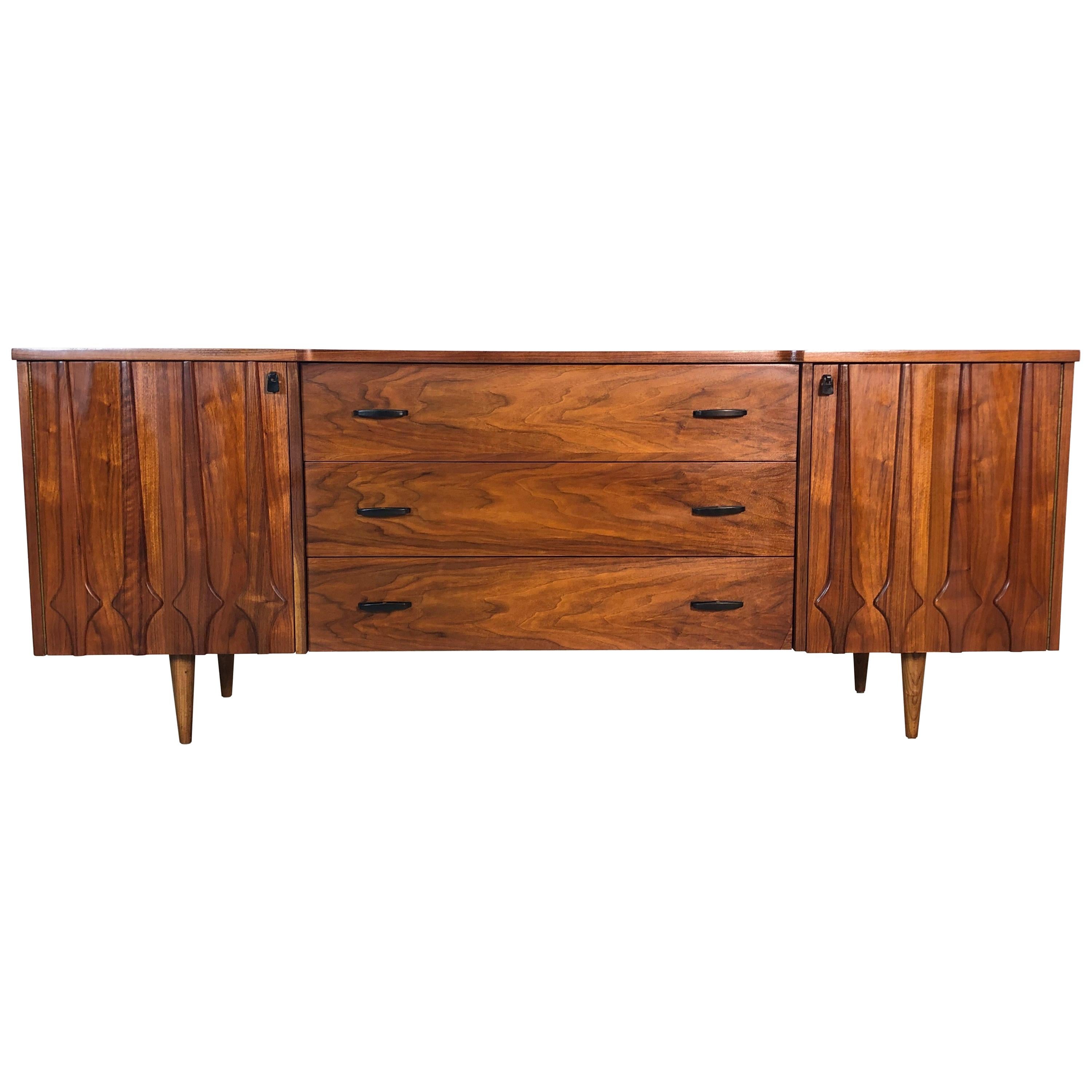 1960s Sculpted Walnut Long Nine Drawer Dresser For Sale