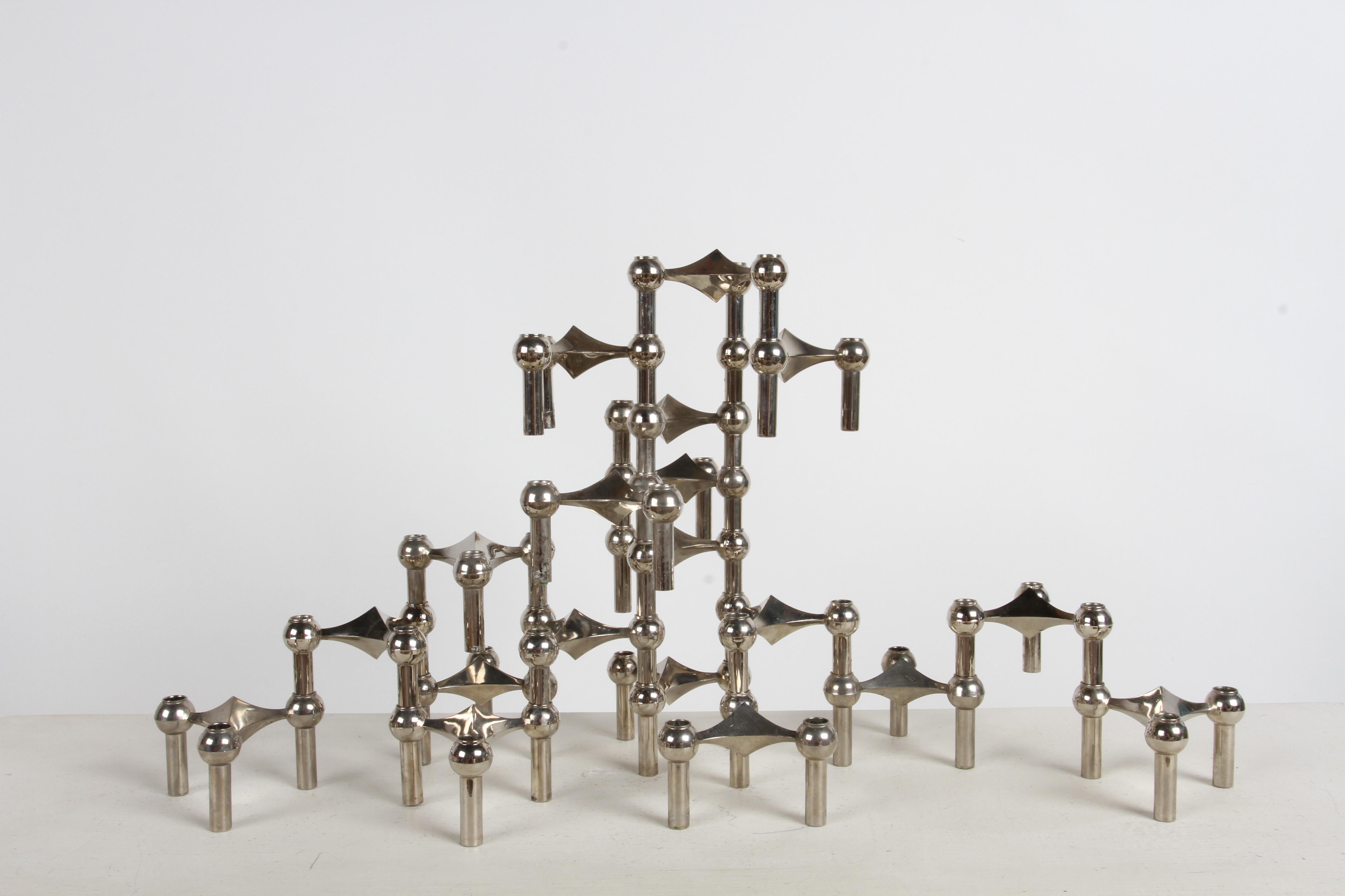 Iconic set of 19 playful stackable or modular designed candlesticks by César Stoffi & Fritz Nagel for BMF Nagel - Germany. Very 1960s mid-century modern in design, little sculptures, each holds three candle sticks, less when stacked, arrangement is