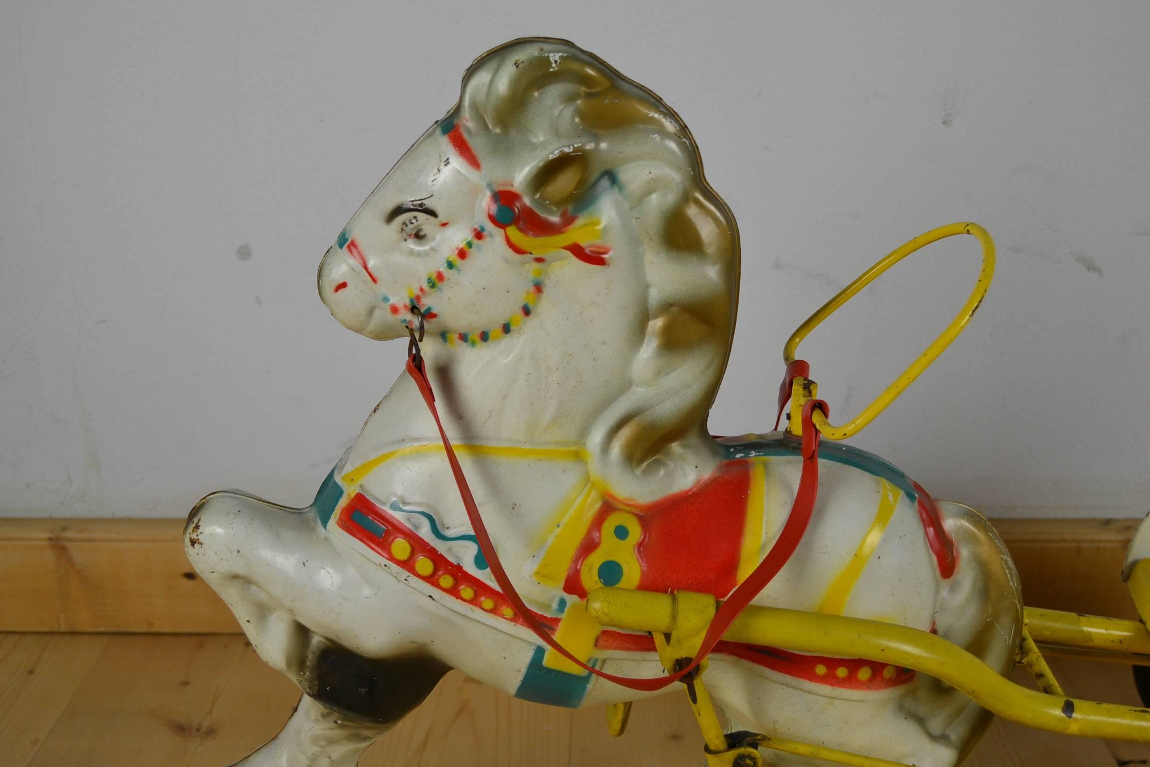1960s vintage Mobo Toy - Sebel Mobo Toy, D. Sebel & co Erith Kent, England.
A pressed steel cute pony horse with a Carrey Trailer.
This Child's ride on toy - pedal toy is in original condition, never repainted.
Comparable with the vintage Mobo