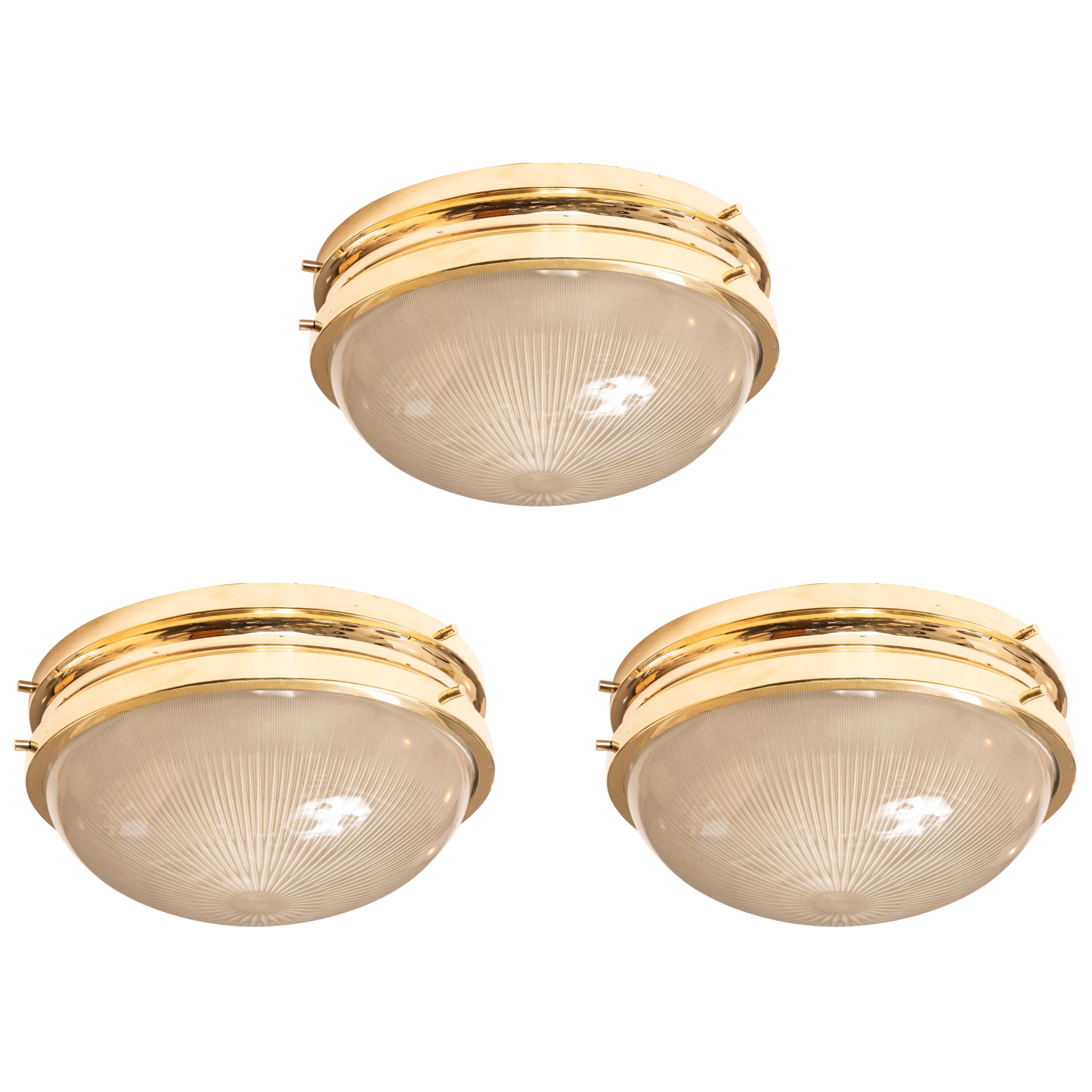 1960s Sergio Mazza Brass 'Sigma' wall or ceiling lights for Artemide. Executed in polished brass and pressed opaline glass by Sergio Mazza for Artemide, Italy, circa 1960s. Professionally rewired for US electrical and accommodates two standard