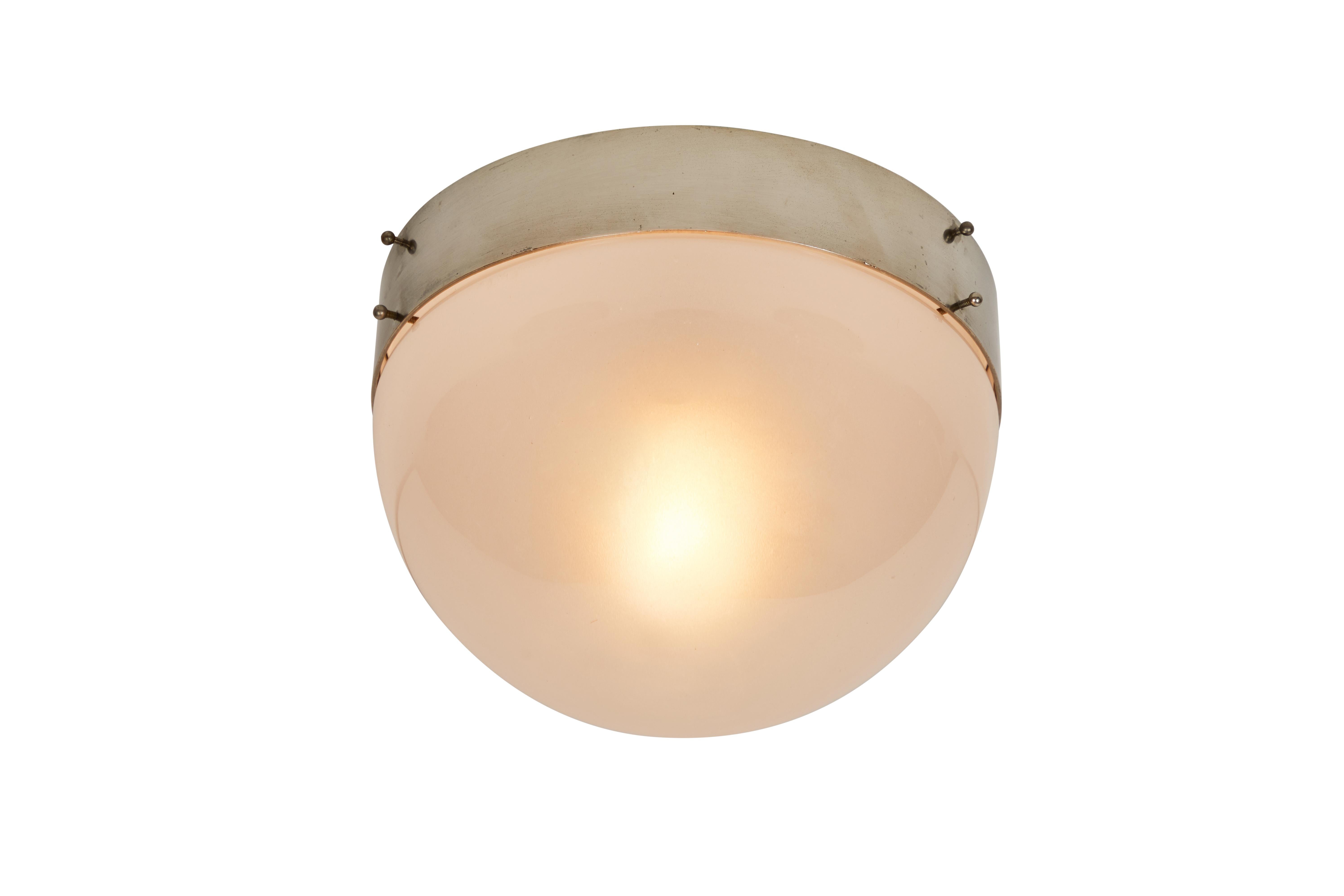 1960s Sergio Mazza 'Demi Clio' wall or ceiling lamp for Artemide. Executed in nickeled brass and opaline glass, Italy, circa 1960s. Clean and architectural, these hardwired lamps emit a pleasingly filtered light through hand blown opaline glass