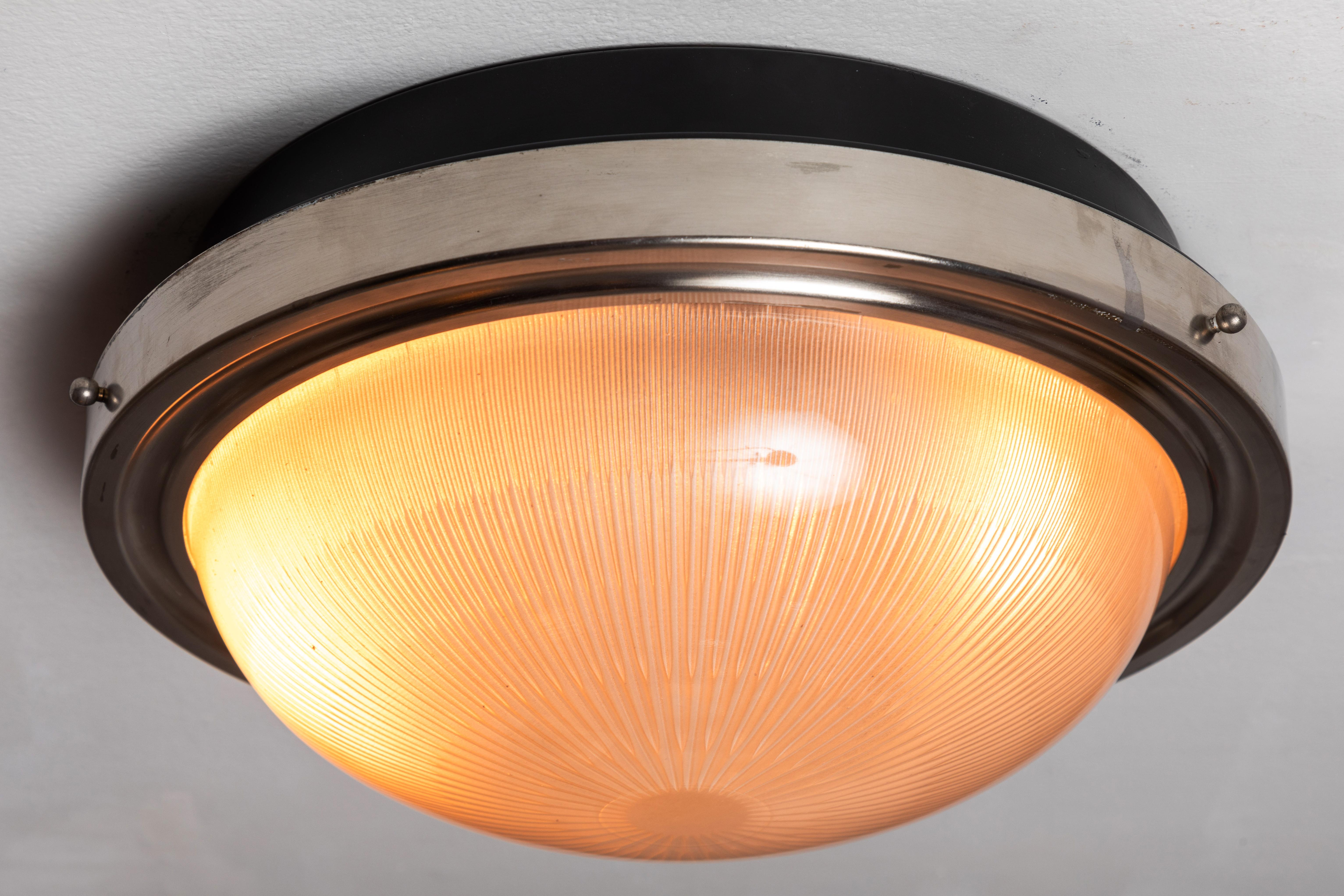 1960s Sergio Mazza nickeled brass ceiling or wall light for Artemide. Executed in pressed opaline glass, black painted metal and nickeled brass.

Born in Italy in 1931, Sergio Mazza created numerous iconic designs for Artemide throughout the 1960s,