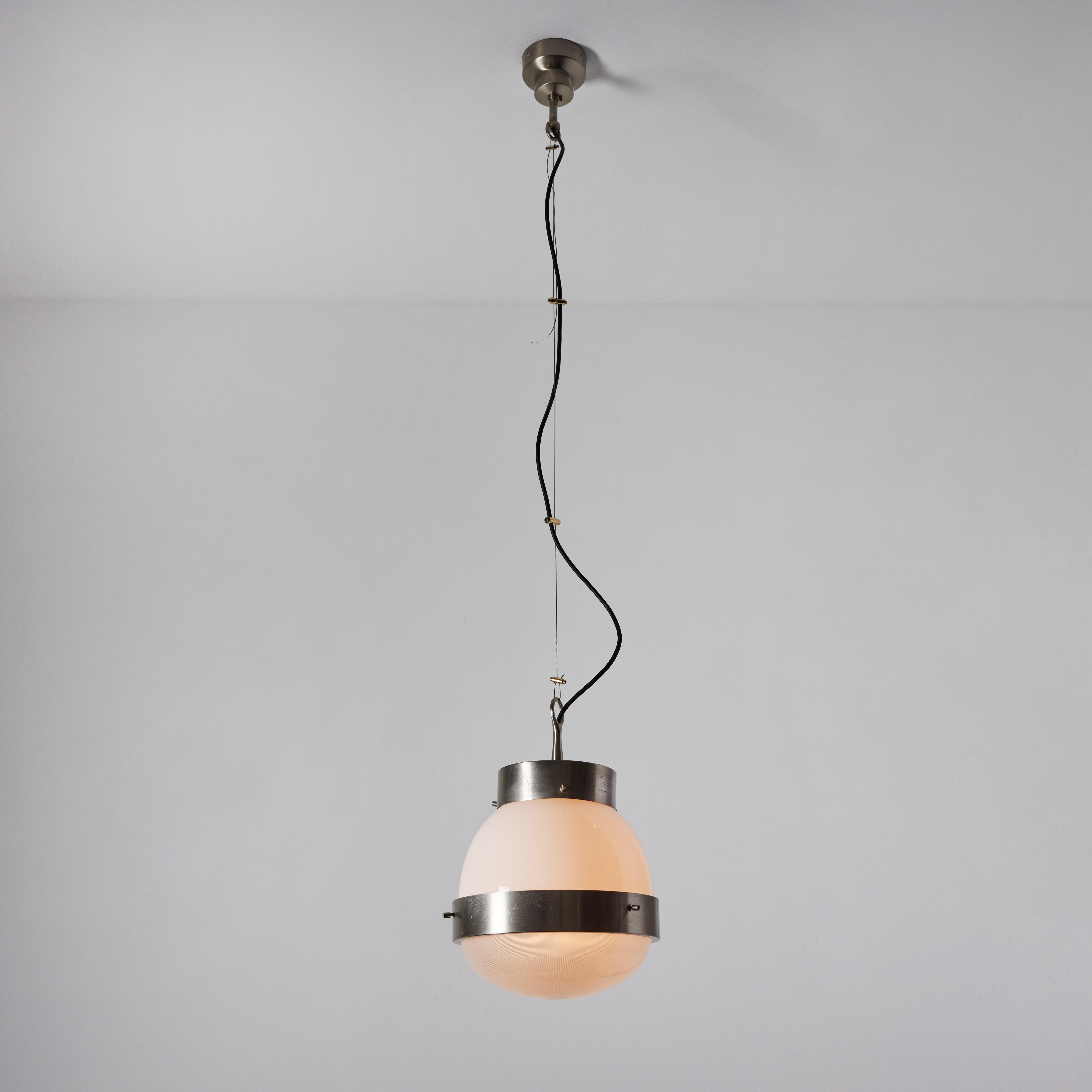 1960s Sergio Mazza 'Delta' pendant for Artmeide. Executed in nickeled brass, opaline and pressed glass. An incredibly warm and refined design from one of Italy's most illustrious midcentury icons. 

Born in Italy in 1931, Sergio Mazza created