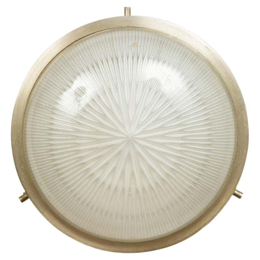 1960s Sergio Mazza Petite 'Sigma' wall or ceiling light for Artemide. Executed in nickeled brass and pressed opaline glass. Minimalist and refined, this iconic lamp can be used for wall or ceiling applications. 

Born in Italy in 1931, Sergio Mazza