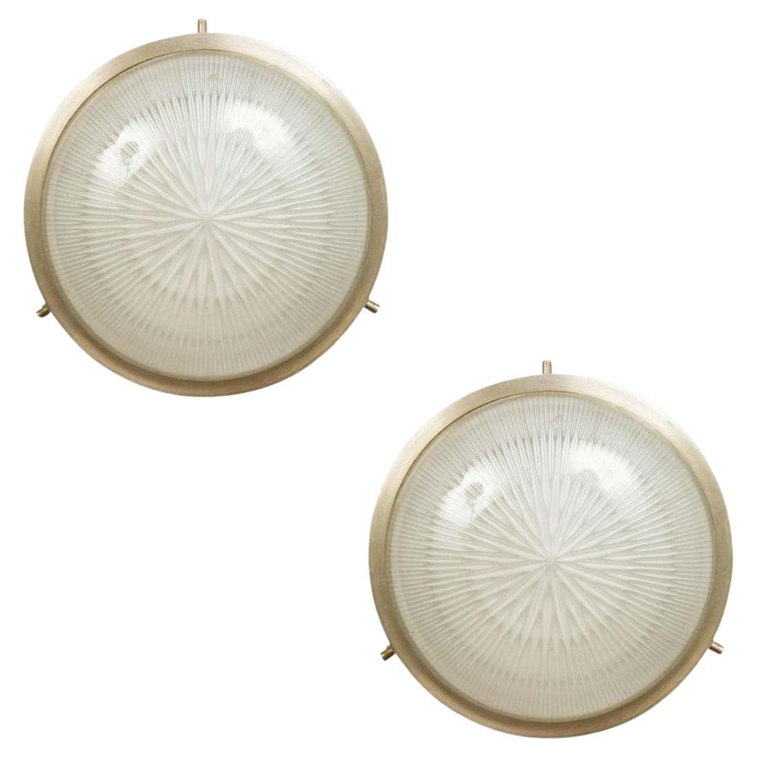 1960s Sergio Mazza Petite 'Sigma' wall or ceiling light for Artemide. Executed in nickeled brass and pressed opaline glass. Minimalist and refined, this iconic lamp can be used for wall or ceiling applications. 

Born in Italy in 1931, Sergio Mazza