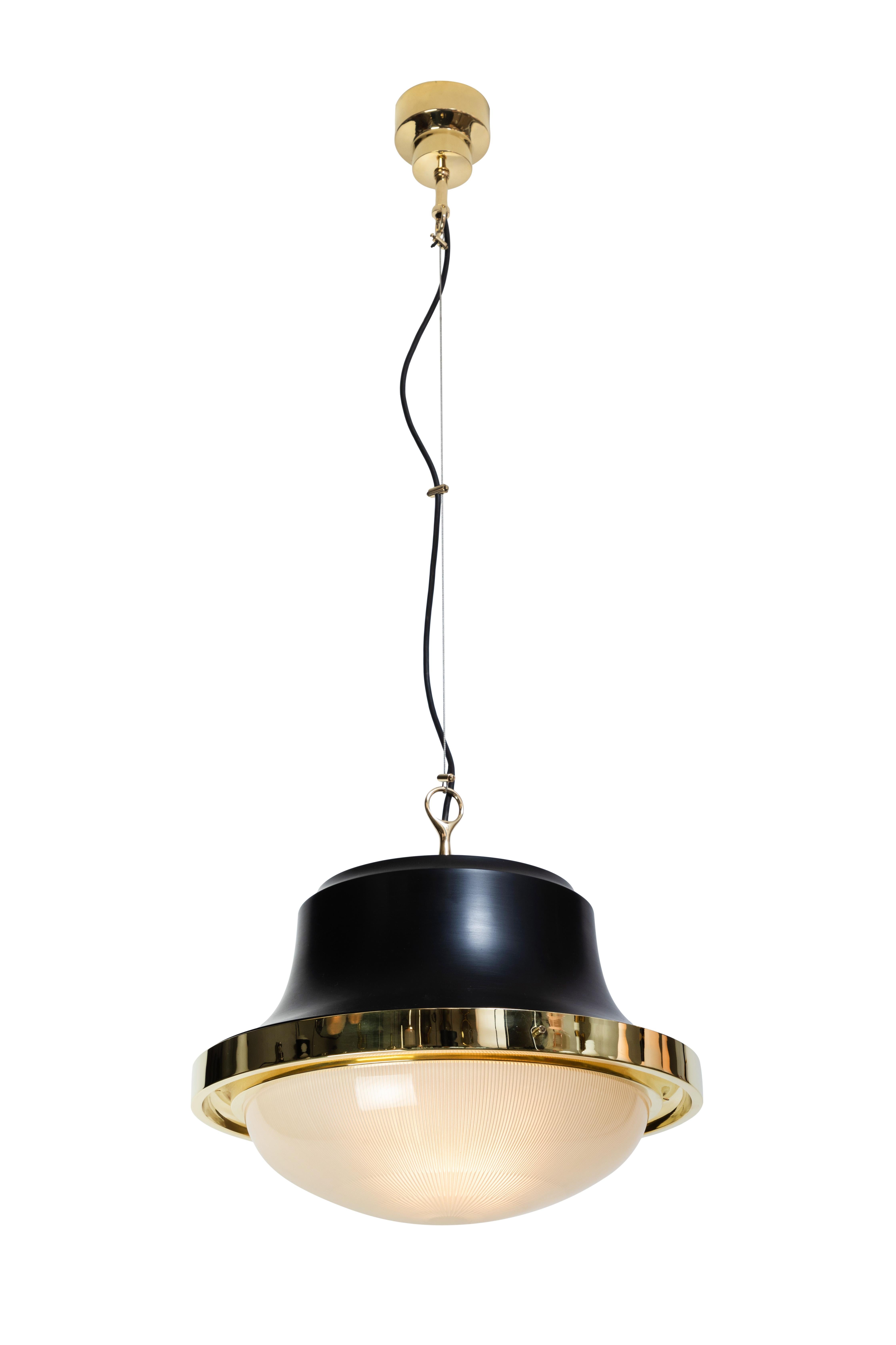 1960s Sergio Mazza 'Tau' pendants for Artmeide. Executed in polished brass, black painted metal, opaline and pressed glass. An incredibly warm and refined design from one of Italy's most illustrious midcentury icons. Height can be adjusted several