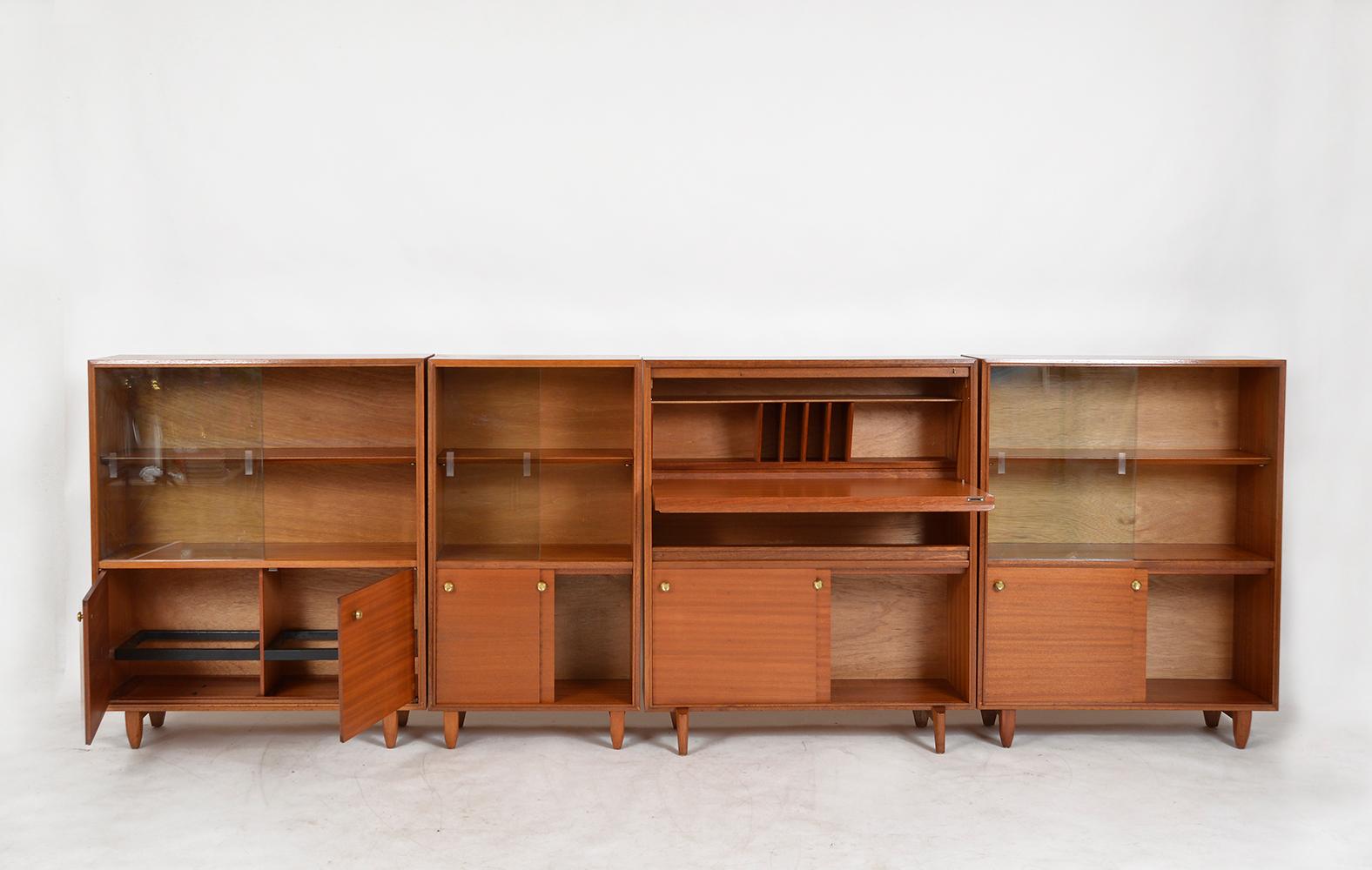 Four sections of ‘multi-width’ cabinets designed by Robert Heritage for Beaver & Tapley. British designer Robert Heritage designed the modular ‘multi-width’ range in 1960, slim and compact enough not to take up too much room in the home, whilst