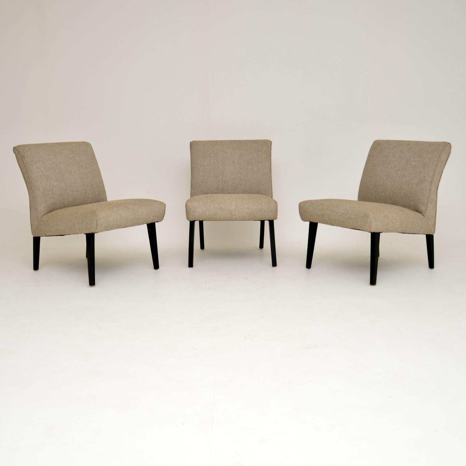 A great set of three vintage chairs from the 1960s. These can be used separately, or pushed together to make a small modular sofa. They are in lovely condition for their age, they look as if they were re-upholstered at some point. The fabric is a