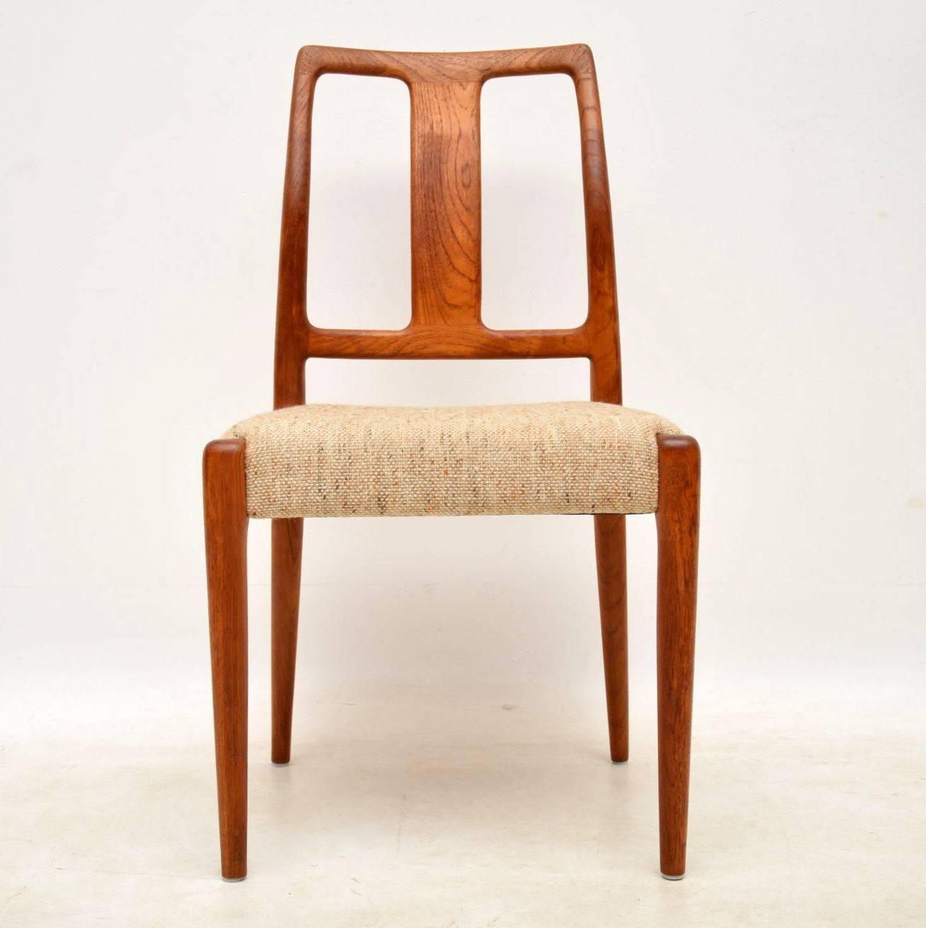 A stunning set of eight Danish teak vintage dining chairs, these date from the 1960s and are in great condition for their age. The original wool upholstery is clean and intact, with only some extremely minor wear. The frames are all clean, sturdy
