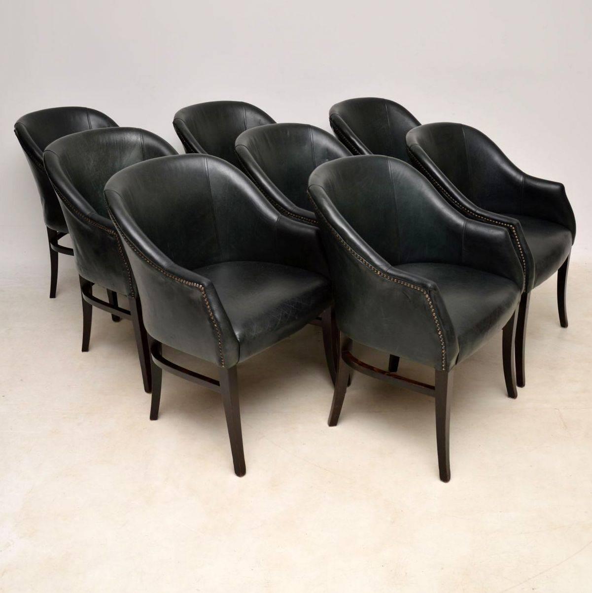 A beautiful set of eight vintage leather tub dining chairs, these date from around the 1960s-1970s. The quality is excellent, they are upholstered in a lovely deep green studded leather. The condition is great for their age, the leather is nicely