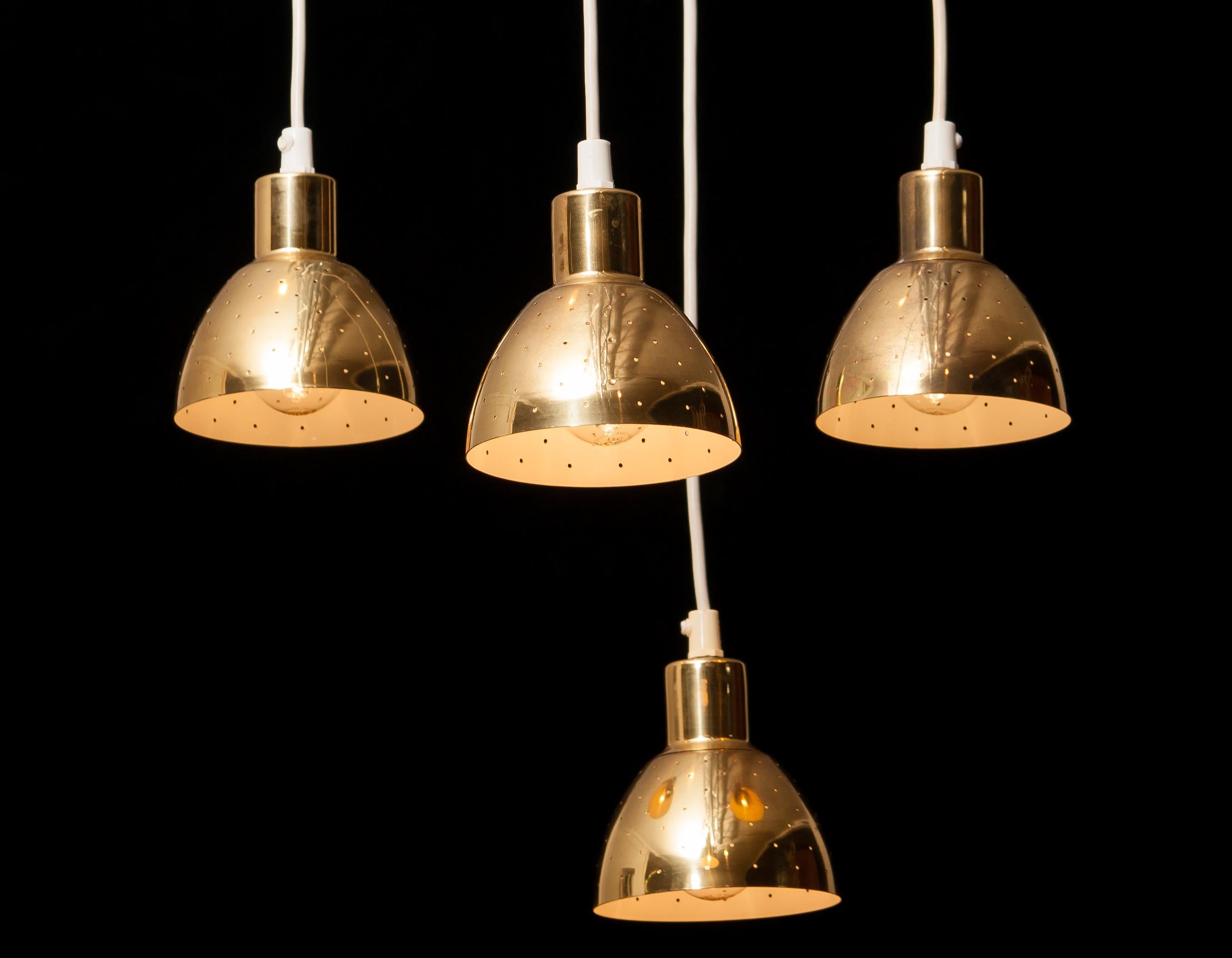Very nice set of four brass pendants by Hans-Agne Jakobsson for Markaryd, Sweden.
Each lamp has perforation with gives the light a beautiful shining.
They are in a good and working condition.
Period 1960s
Dimensions H 11 cm, ø 11 cm.