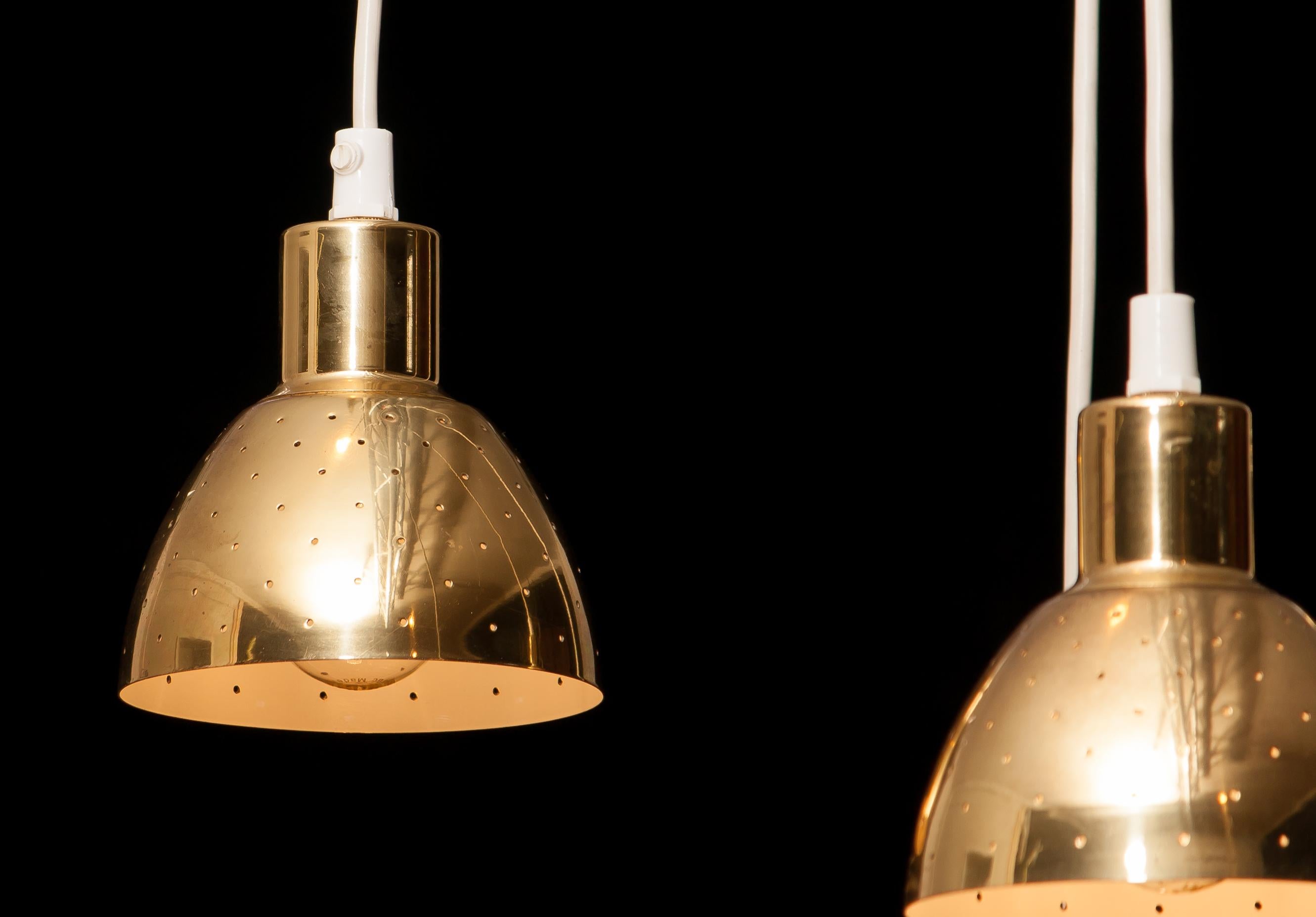 Very nice set of four brass pendants by Hans-Agne Jakobsson for Markaryd, Sweden.
Each lamp has perforation with gives the light a beautiful shining.
They are in a good and working condition.
Period 1960s
Dimensions H 11 cm, ø 11 cm.