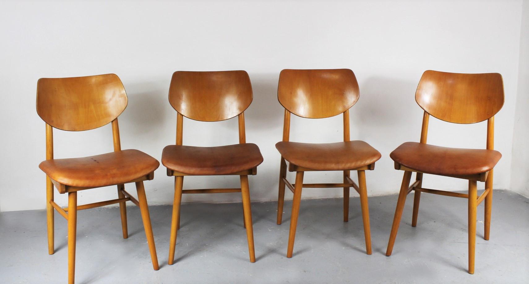 Set of four chairs from the 1960, manufactured by Ton and Jitona. The seats have been reupholstered in goat leather. Good condition, nice patina.