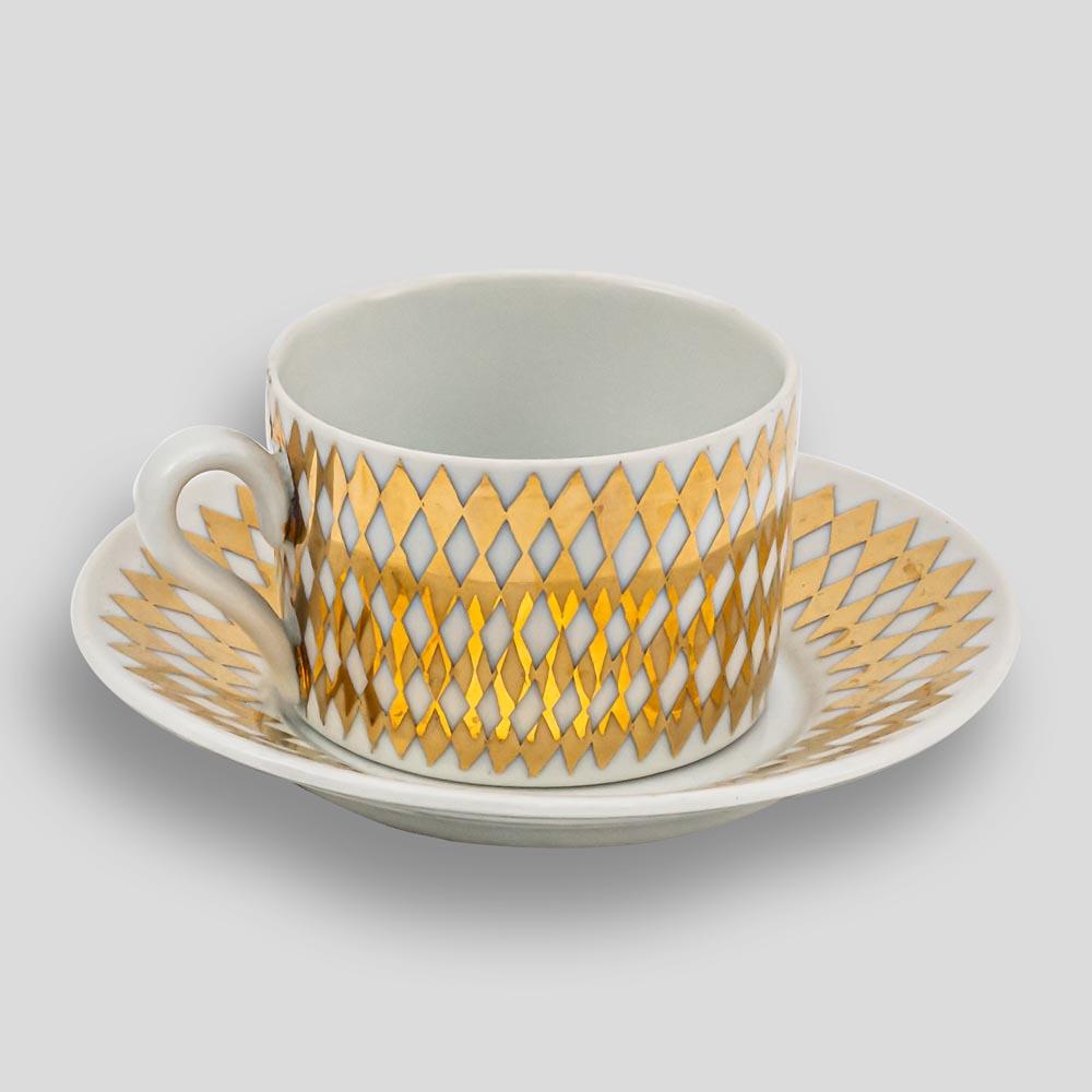 A good vintage Set of six Fornasetti porcelain tea/coffee cups and saucers with geometrical gold decor. Each cup and saucer bearing the signature and logo. Made in Italy ca.1960s

Saucers; 14 cm (diameter) x 2.5cms (height). Cups: 8 cm (diameter)