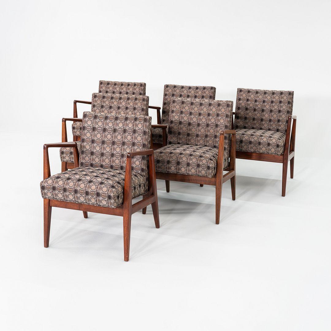 This is a set of six walnut dining armchairs, Model C-120, designed by Jens Risom in the USA in ca. 1958. This set dates to the late 1960s. The listed price includes the set of six chairs as shown. Their design features a walnut frame having angular