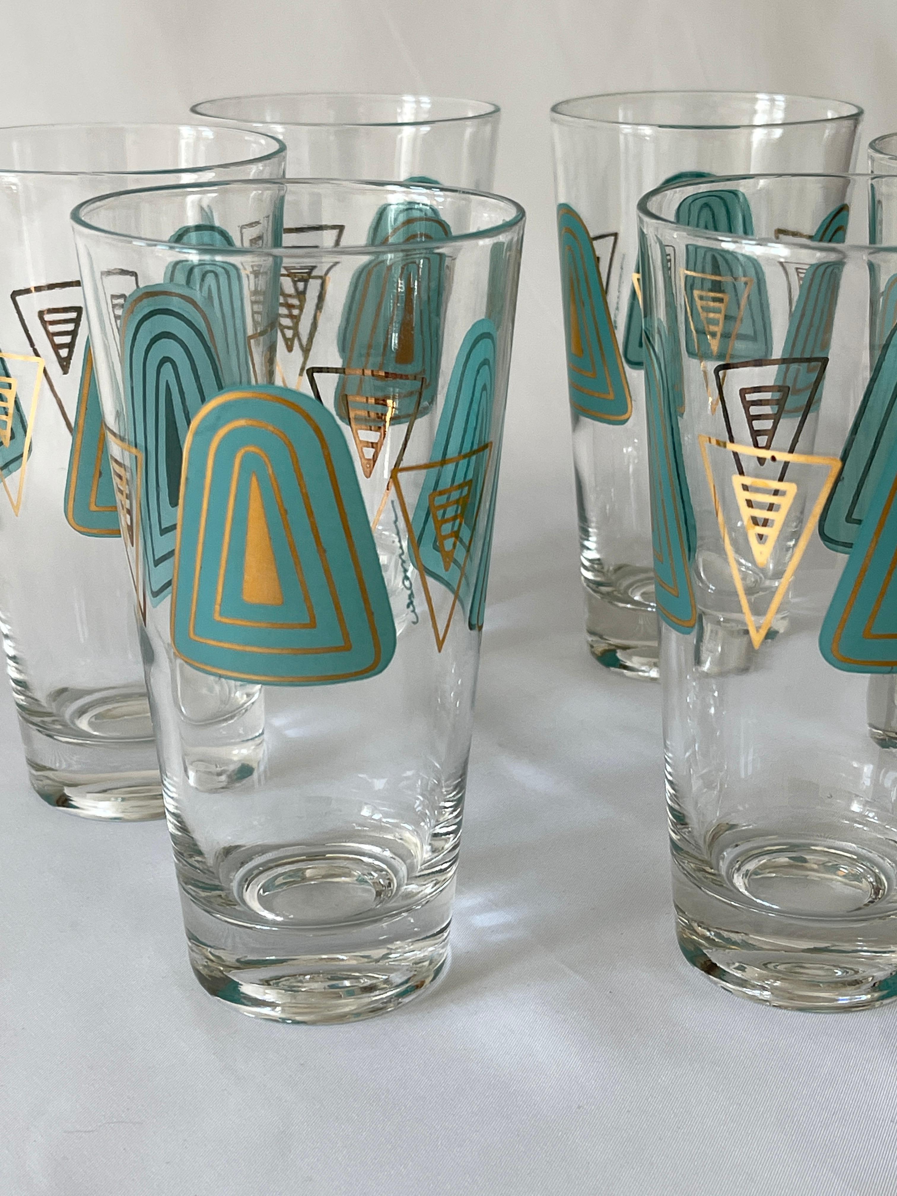 Set of six 1960's turquoise, white and gilt decorated tall highball / lemonade glasses, each signed by the artist .