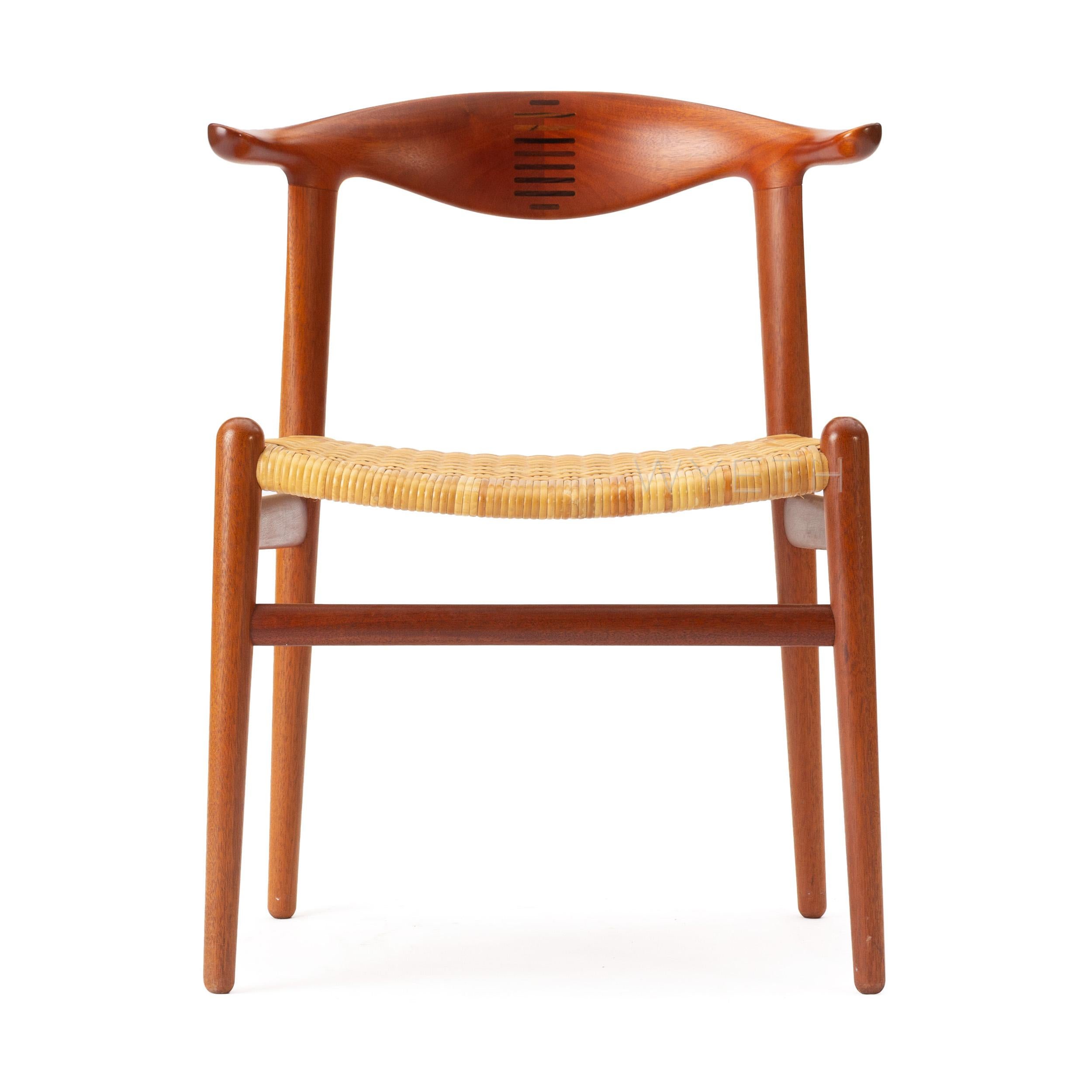 Newly restored rare teak 'cow horn' dining chair with splined backrest and cane seat. Model JH-505.