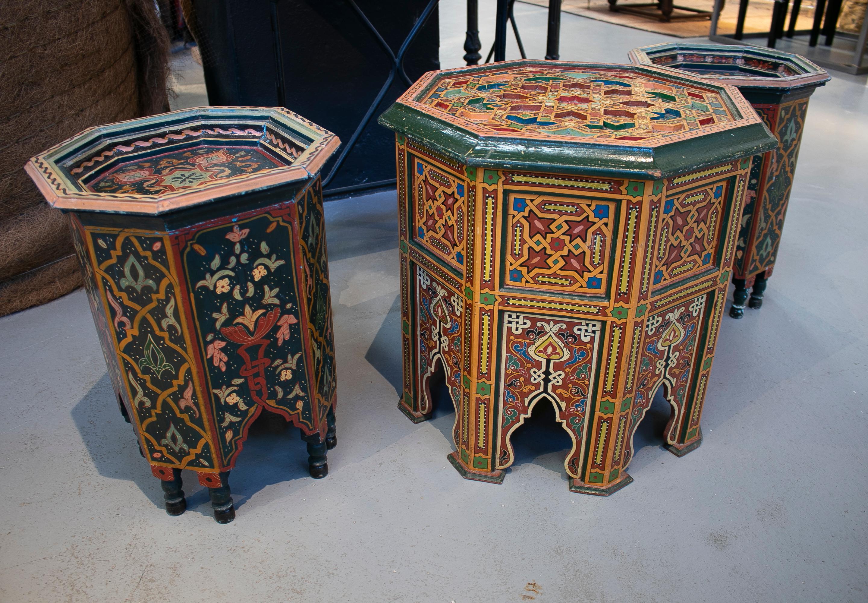 1960s set of three Moroccan octagonal wooden hand carved and painted side tables.

Small size dimensions: 48 x 35 x 35cm
Large size dimensions: 50 x 50 x 50cm.