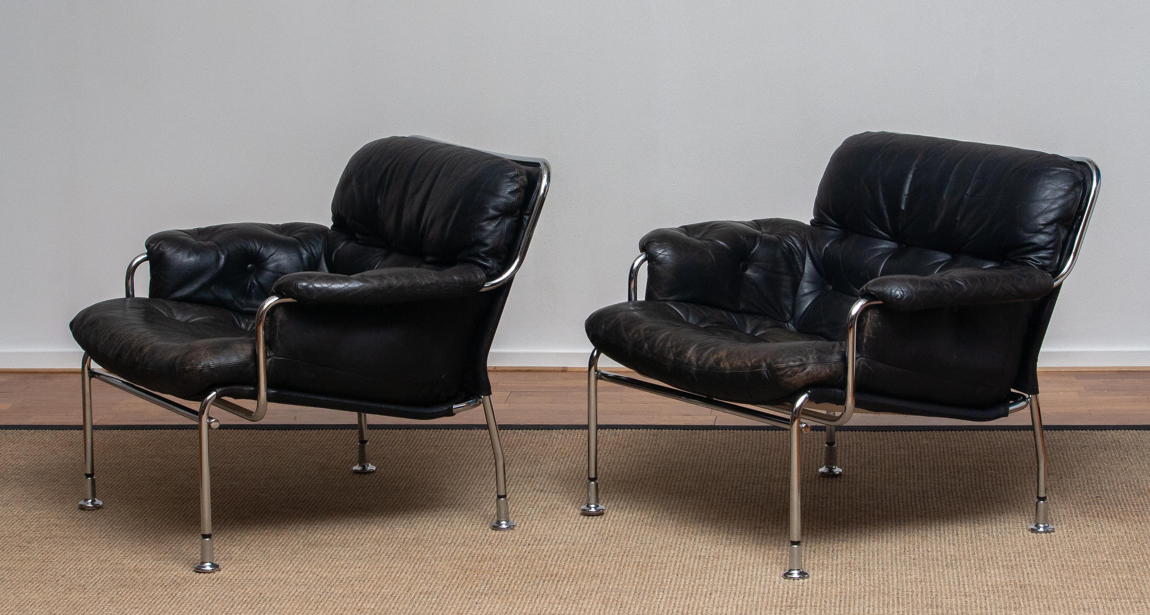 Mid-Century Modern 1960s Set of Two Eva Lounge Chairs in Chrome and Aged Black Leather by Lindlöfs