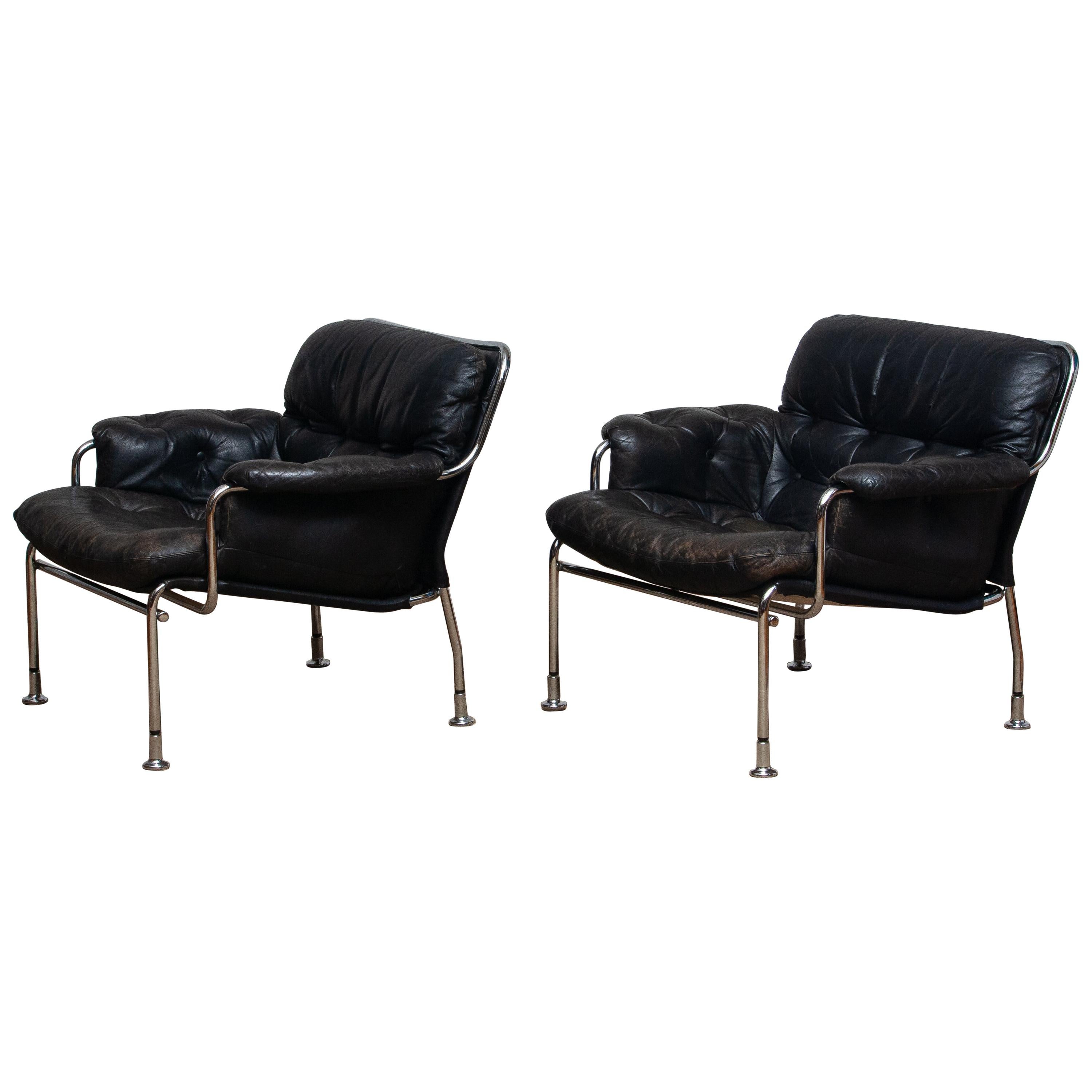 1960s Set of Two Eva Lounge Chairs in Chrome and Aged Black Leather by Lindlöfs