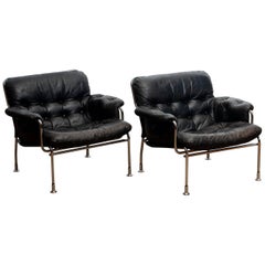 Vintage 1960s Set of Two Eva Lounge Chairs in Chrome and Aged Black Leather by Lindlöfs