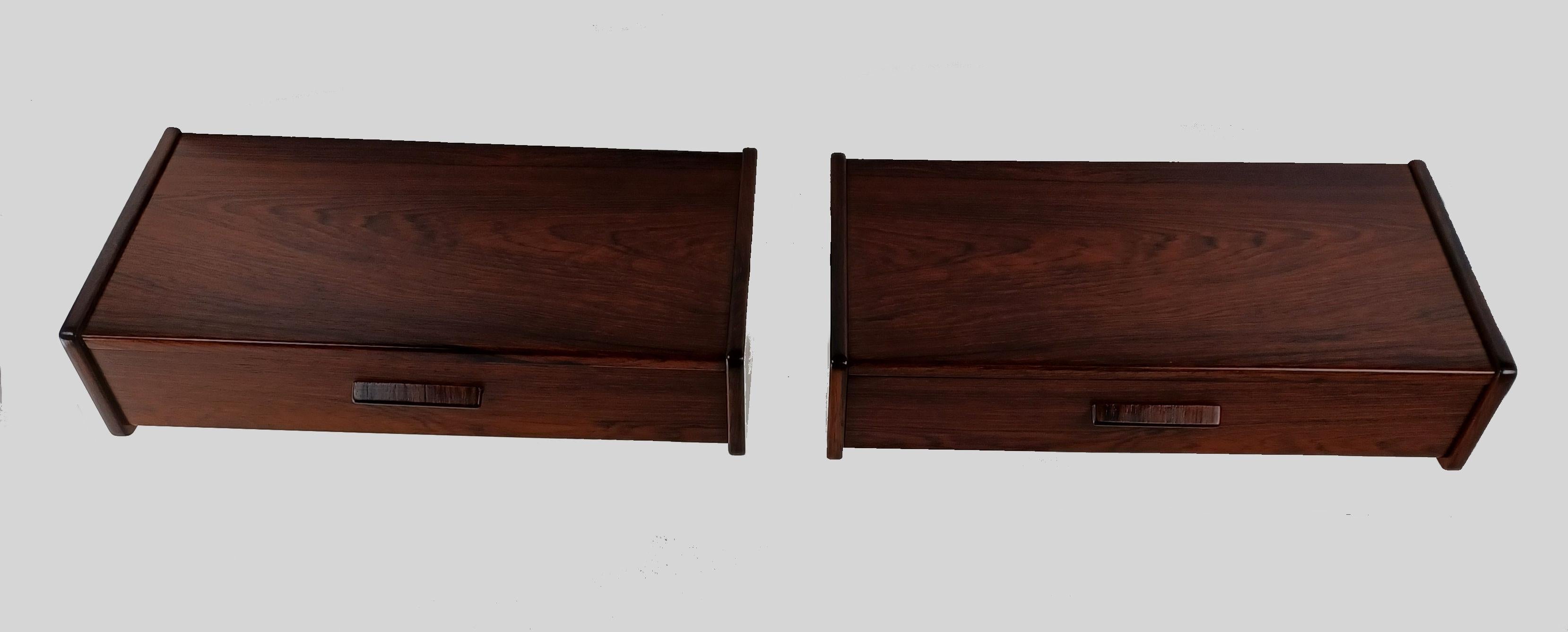 Set of two fully restored Danish Poul Volther floating rosewood nightstands.

The nightstands are examples of the minimalistic and functional yet beautiful design and advanced craftmanship that characterized Danish midcentury furniture. 

The