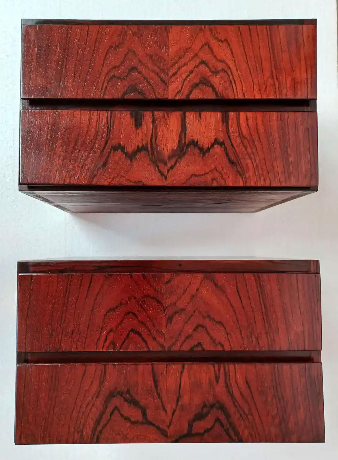 1960s set of two fully restored Danish floating rosewood night stands attributed to Omann Jun

The nightstands combination of a strict minimalistic designed cabinet softend by the organic skaped grips in the drawers and dimensions create a uniqe