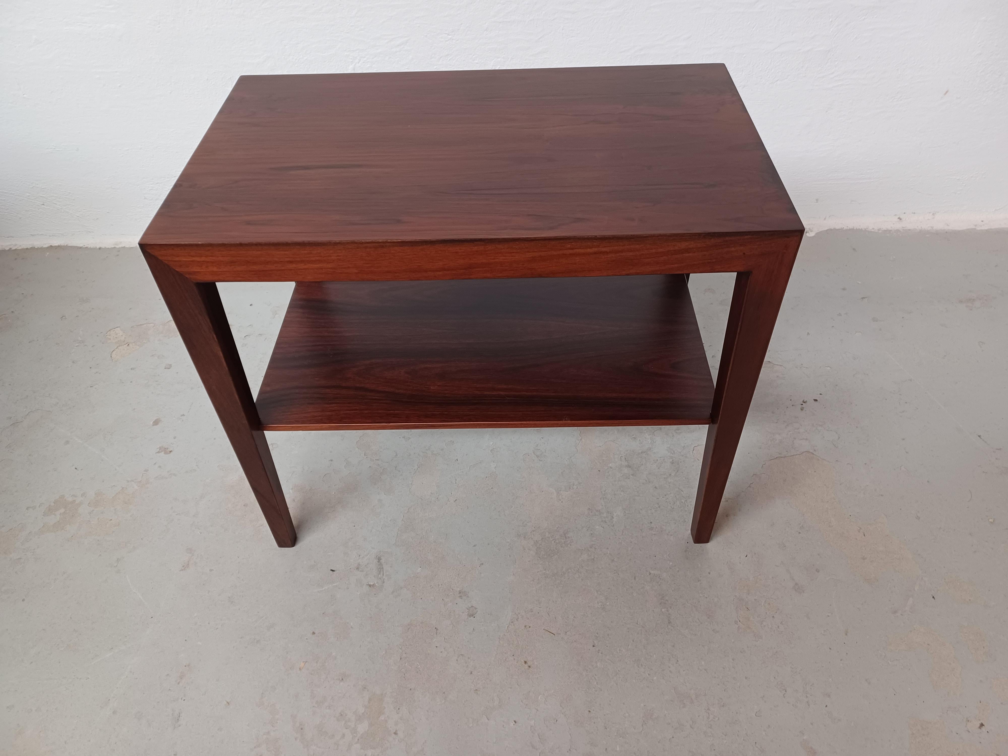 Severin Hansen fully restored rosewood side table with shelf by Haslev Møbelsnedkeri Denmark.

These Severin Hansen tables are not often seen with a shelf like this table. The table has a very clean, modest and simple yet elegant design and features