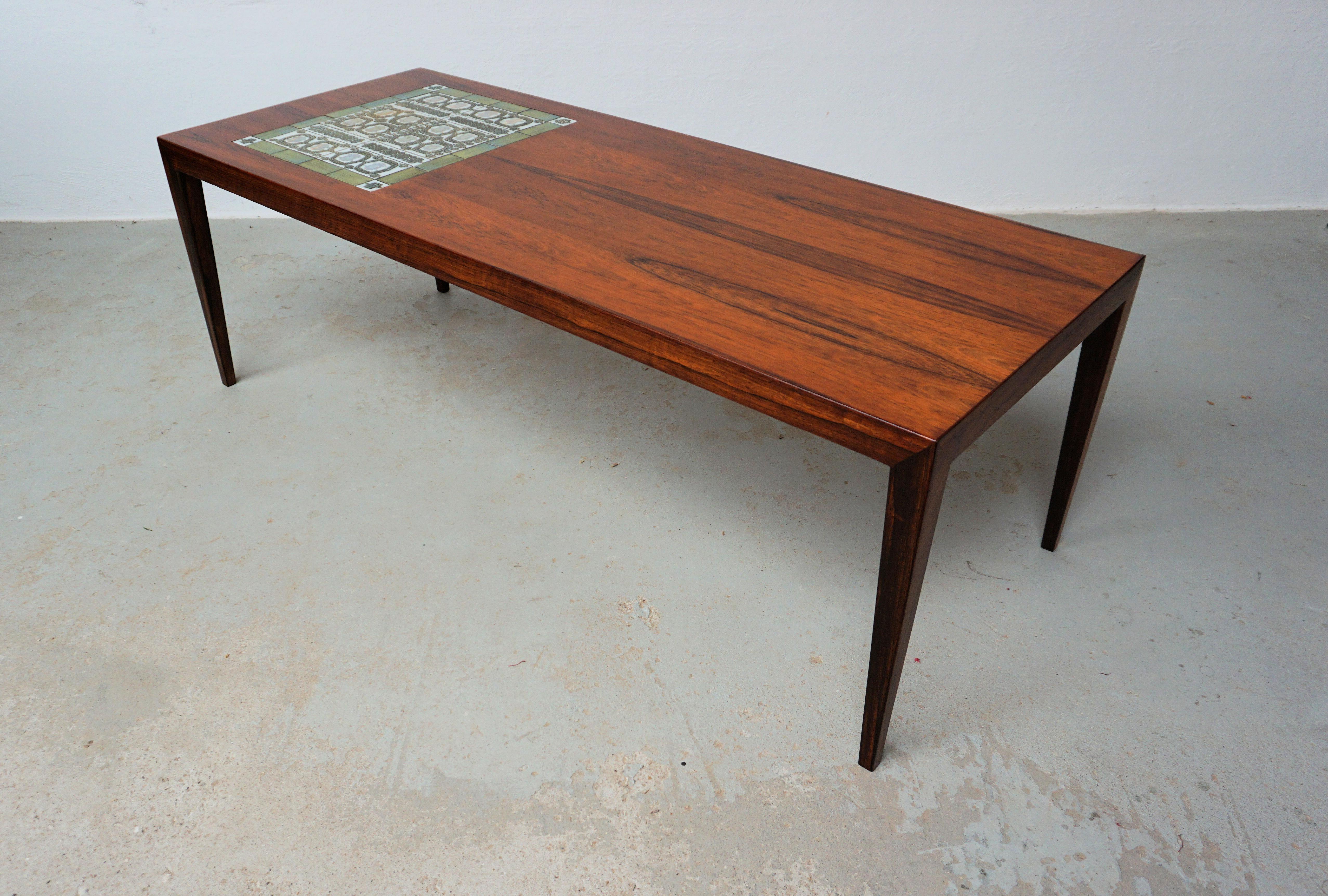 Rosewood Coffee table designed by Severin Hansen for Haslev Møbelsnedkeri with Niels Thorsson tiles made by Royal Copenhagen, Denmark.

The Coffee table feature the signature corner joints often used by Severin hansen on his tables and 1960's /