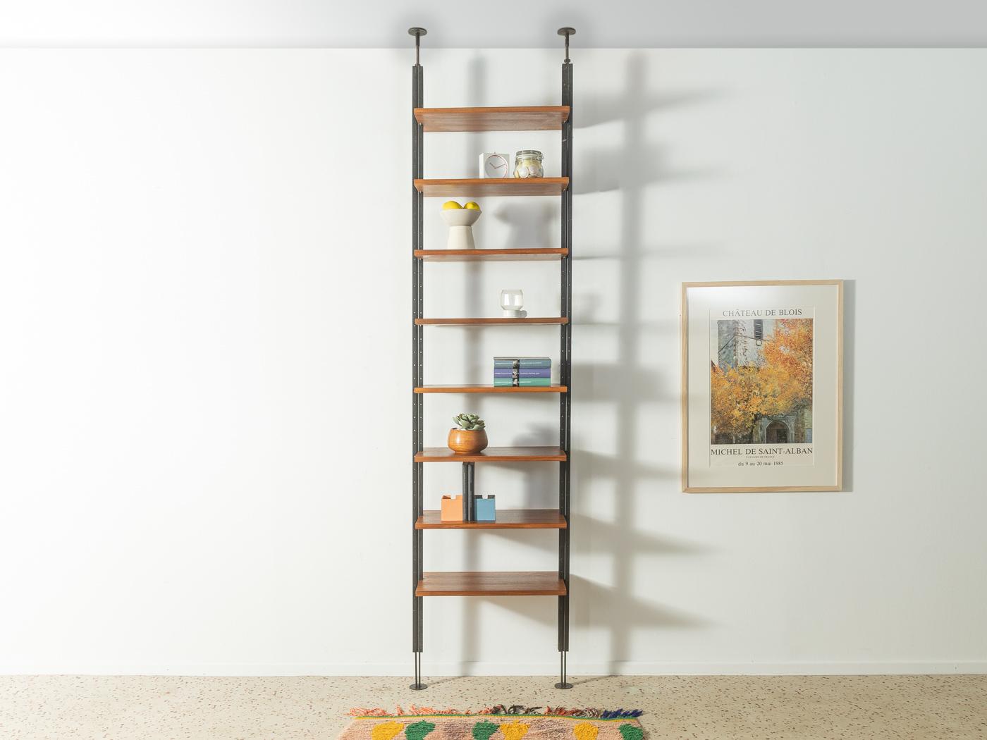 Rare shelving system from the 1960s in walnut veneer. The system was designed by austro-american architect Richard Neutra and was produced in a limited edition for some of his realized residential buildings. The shelving system consists of two