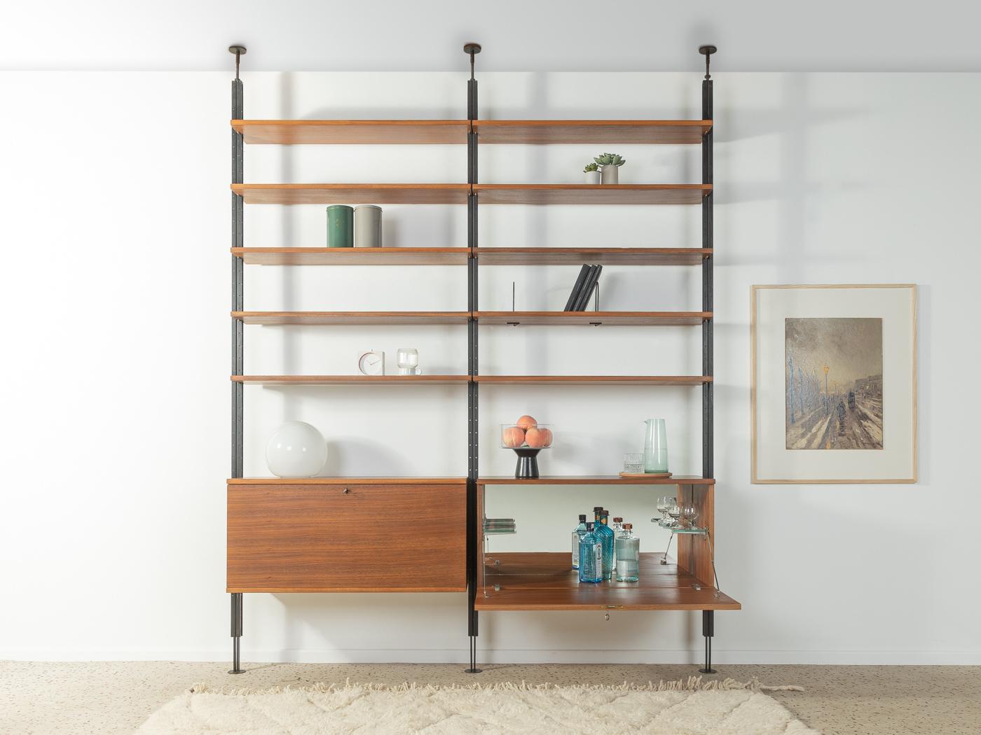 Rare clamping column shelf from the 1960s in walnut veneer. The system was designed by austro-american architect Richard Neutra and was produced in a limited edition for some of his realized residential buildings. The shelf consists of three