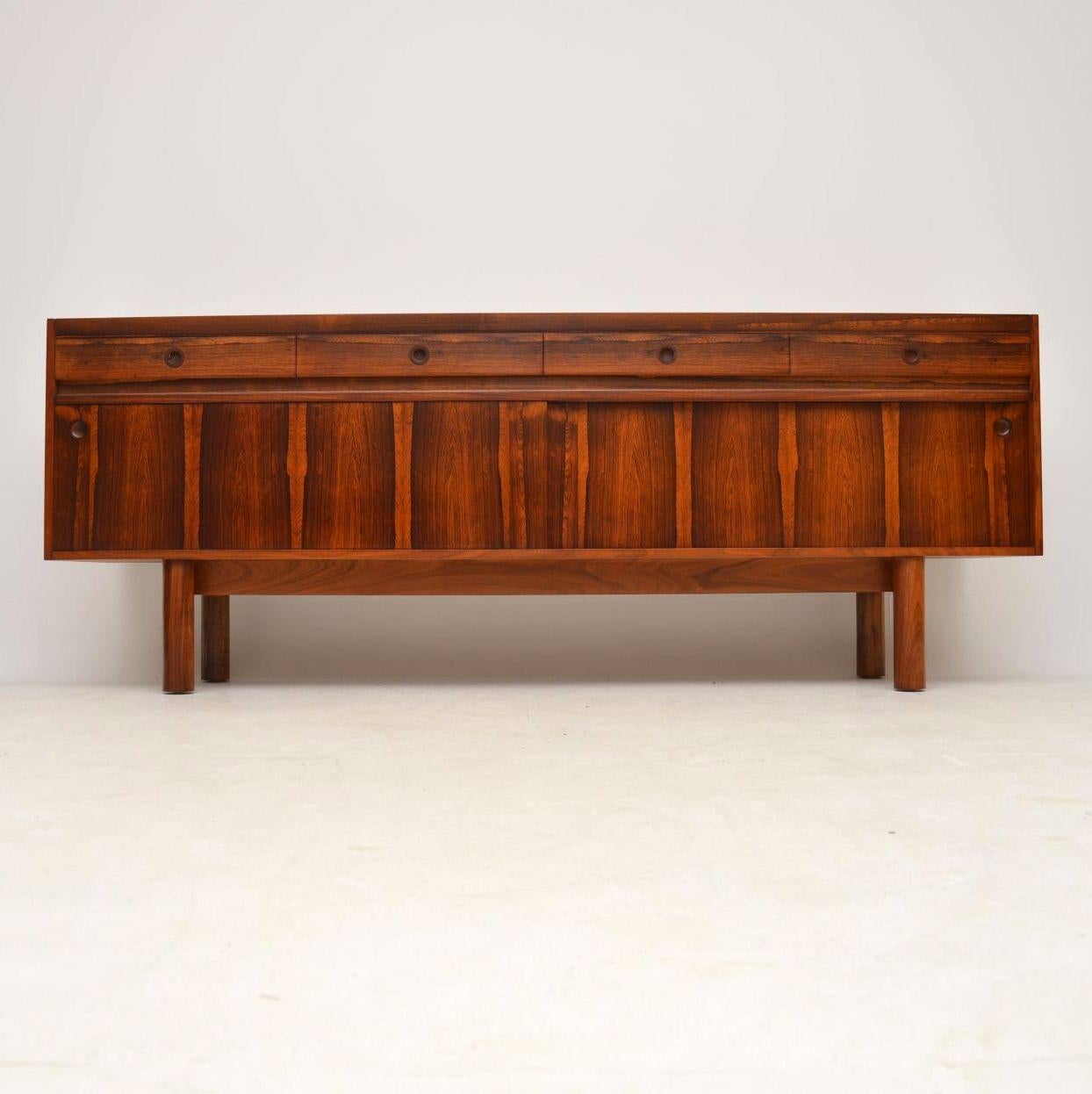 A stunning vintage sideboard, this was designed by Robert Heritage and was made by Archie Shine in the 1960s. It’s of amazing quality, with stunning wood grain patterns and a beautiful color. We have had this stripped and re-polished to a very high