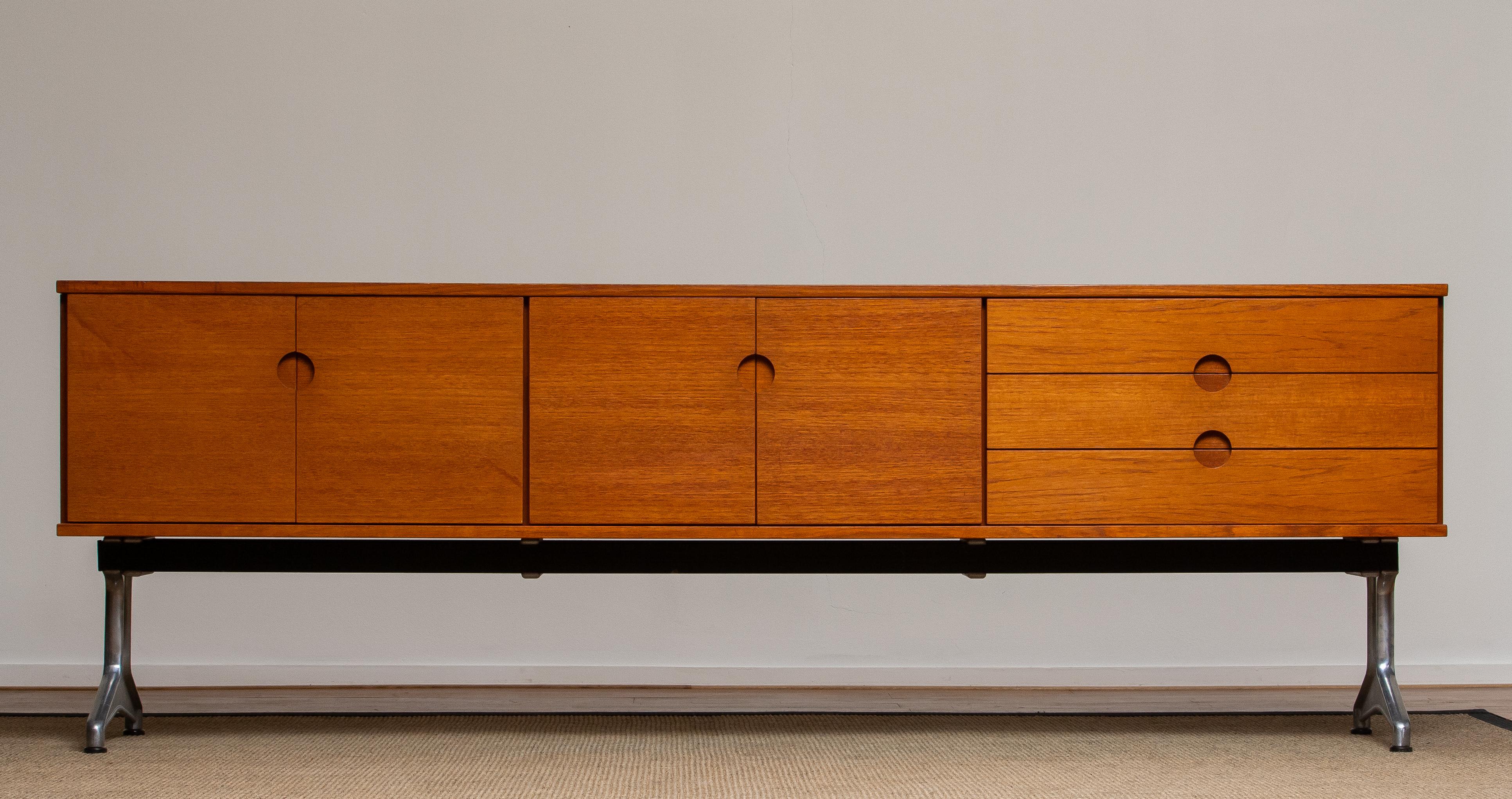 Beautiful Norwegian sideboard / credenzas designed in the 1960s by Pertti Salmi for Vilka Oy in Nastola Soumi, Norway. Consists three drawers and four doors. In both internal cabinets is a removable shelf.
Very nice detail are the milled handles in