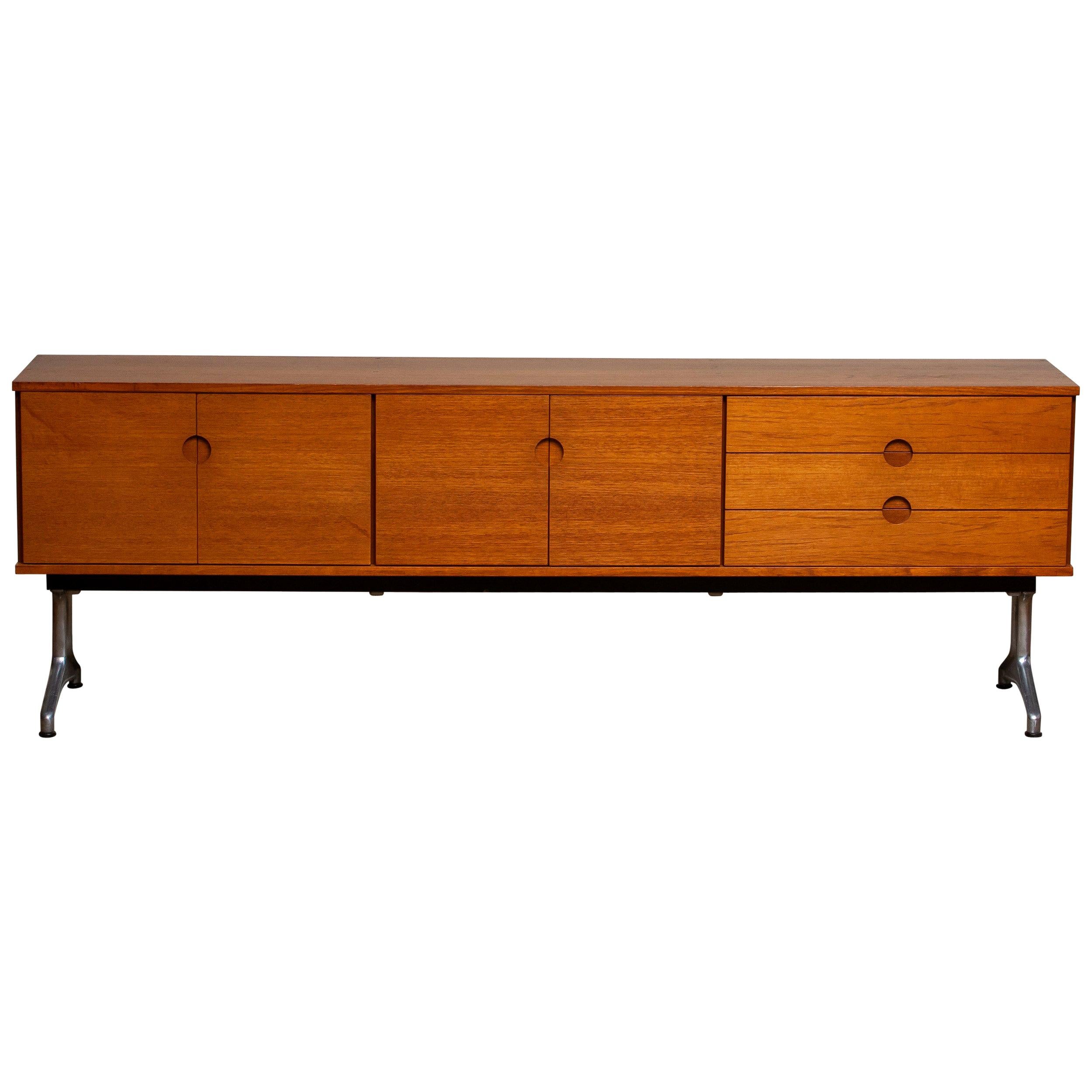 Beautiful Norwegian sideboard / credenzas designed in the 1960s by Pertti Salmi for Vilka Oy in Nastola Soumi, Norway. Consists three drawers and four doors. In both internal cabinets is a removable shelf.
Very nice detail are the milled handles in