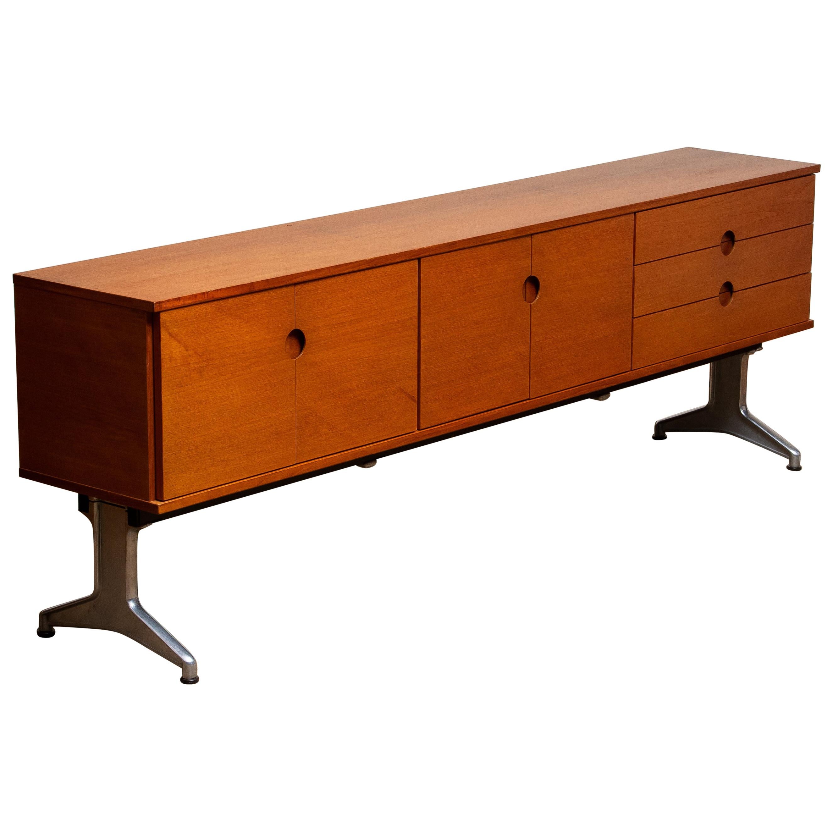 Beautiful Norwegian sideboard / credenzas designed in the 1960s by Pertti Salmi for Vilka Oy in Nastola Soumi, Norway. Consists three drawers and four doors. In both internal cabinets is a removable shelf.
Very nice detail are the milled handles in