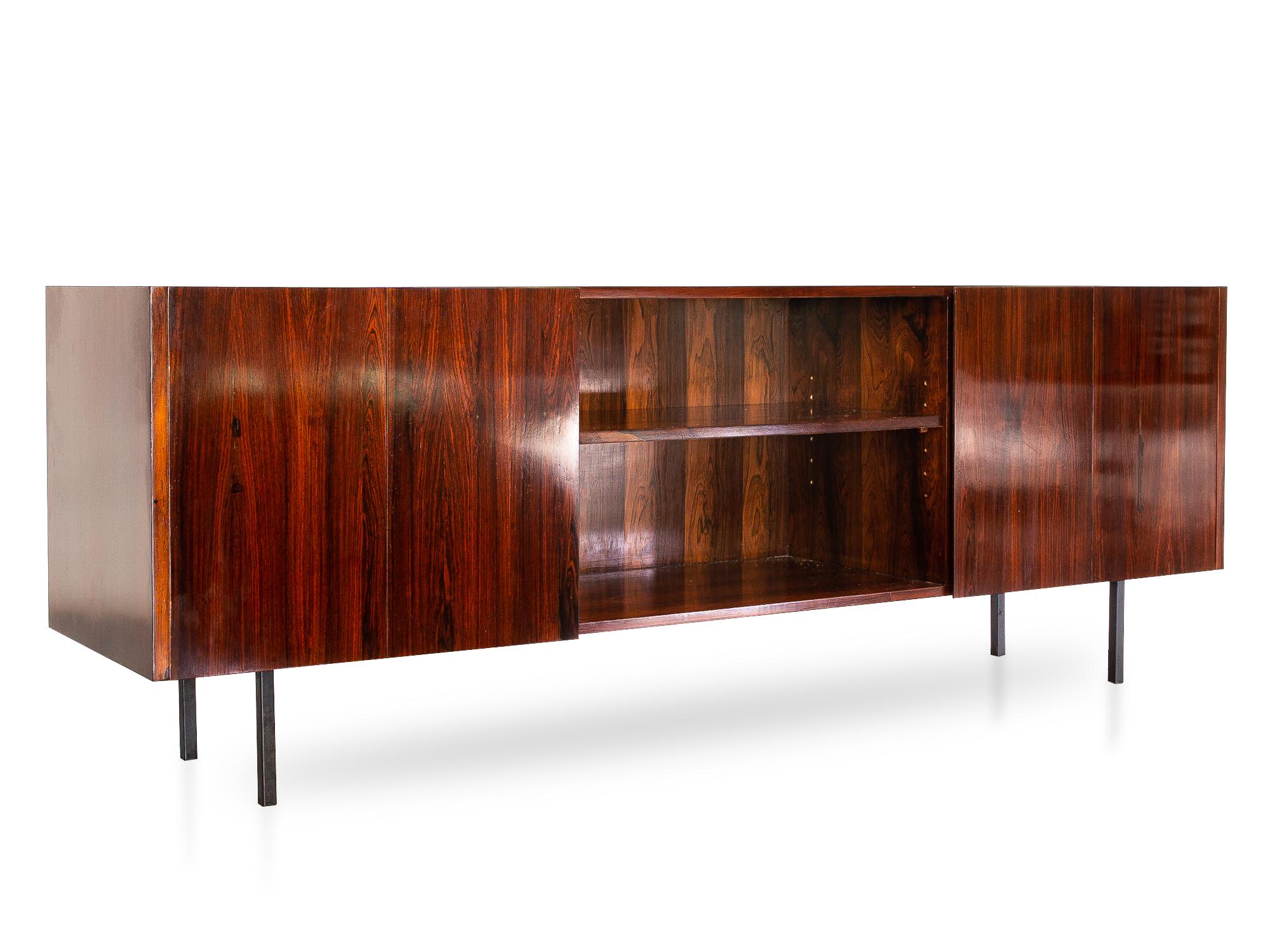 Produced by Móveis Ambiente, and designed by Carlo Fongaro, this beautiful Minimalist credenza or sideboard is sure to fit in any room!

The doors are hinged in the middle, making them open without taking much space. The interiors are lined in