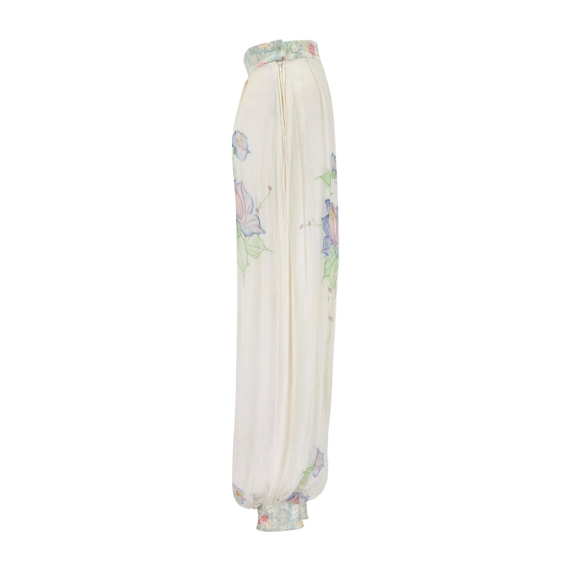 A really unusual and rare piece from the late 1960s, these romantic trousers are tailored to a high-waist fit with flowing harem-cut legs and they may have been made repurposing earlier fabrics. Machine sewn from sheer silk chiffon, they are
