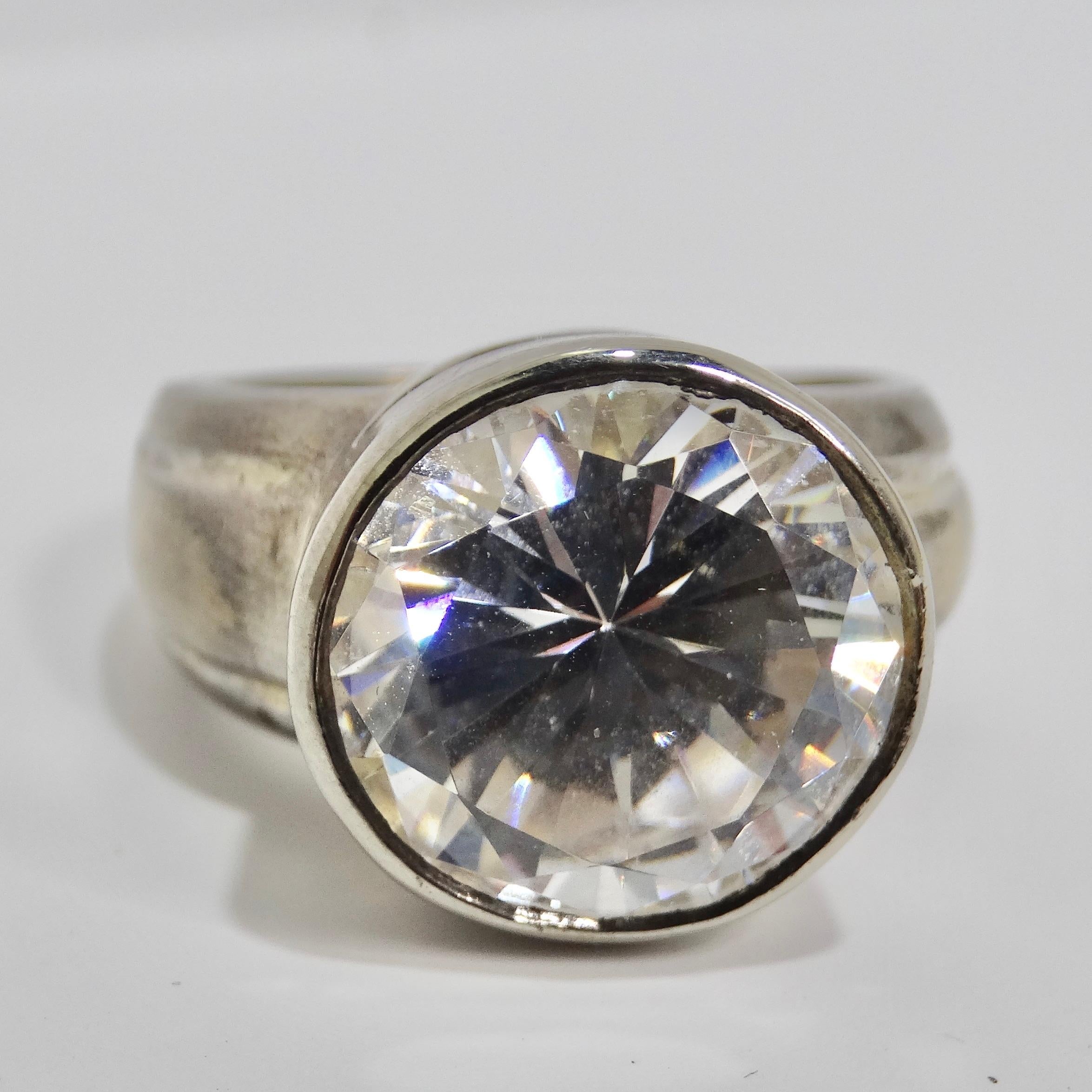 Step back in time to the glamour of the 1960s with our exquisite Silver Cubic Zirconia Ring. Crafted from pure 925 sterling silver, this vintage-inspired piece exudes classic charm and versatility that's perfect for any occasion. This ring is