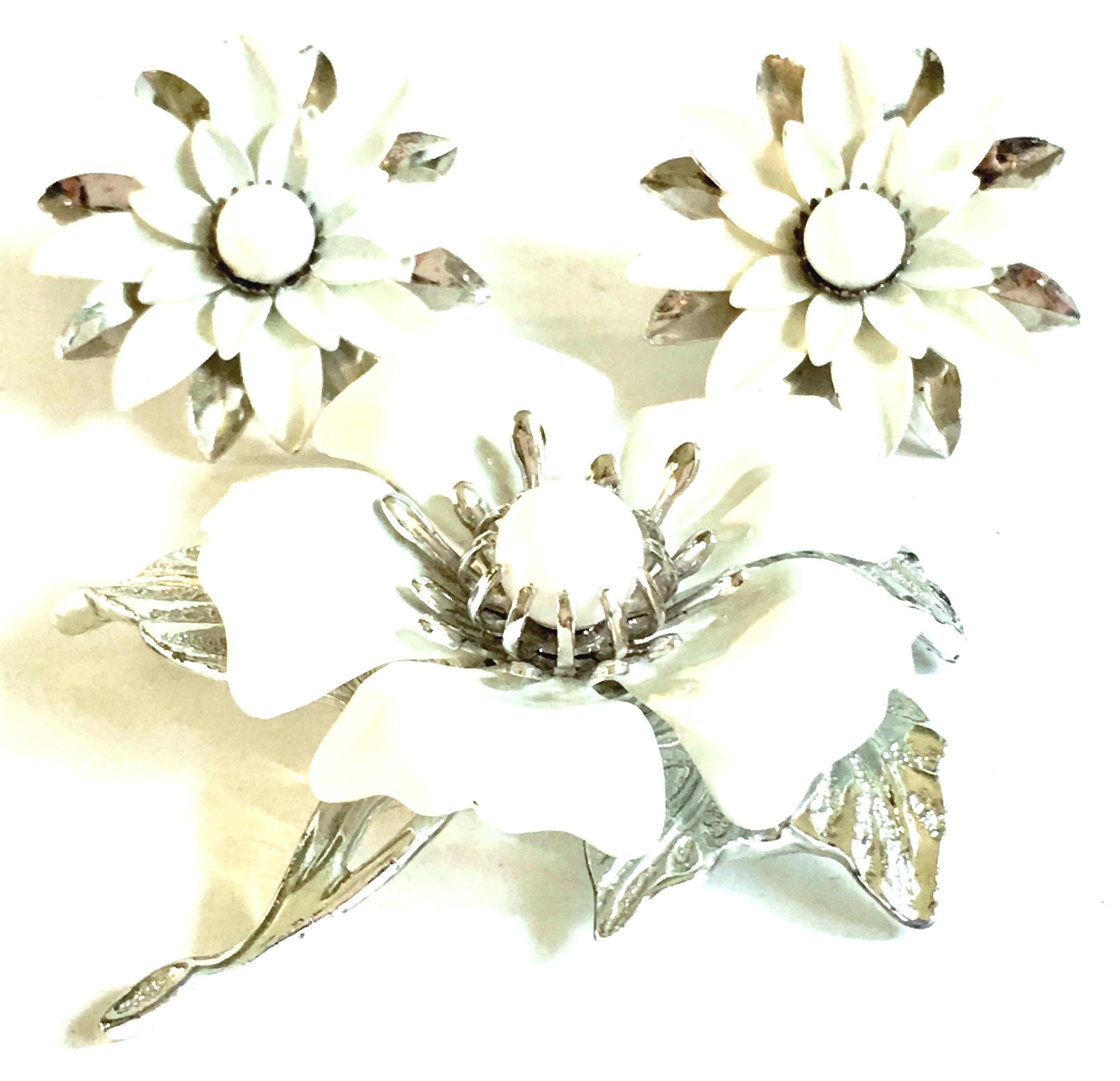 1960'S Silver Plate & Enamel Modernist Abstract Dimensional Big Flower Brooch & Earrings By, Sarah Coventry. Features bright white enamel over silver plate metal. Each of the three pieces are signed on the underside, Sarah Cov.
The clip style