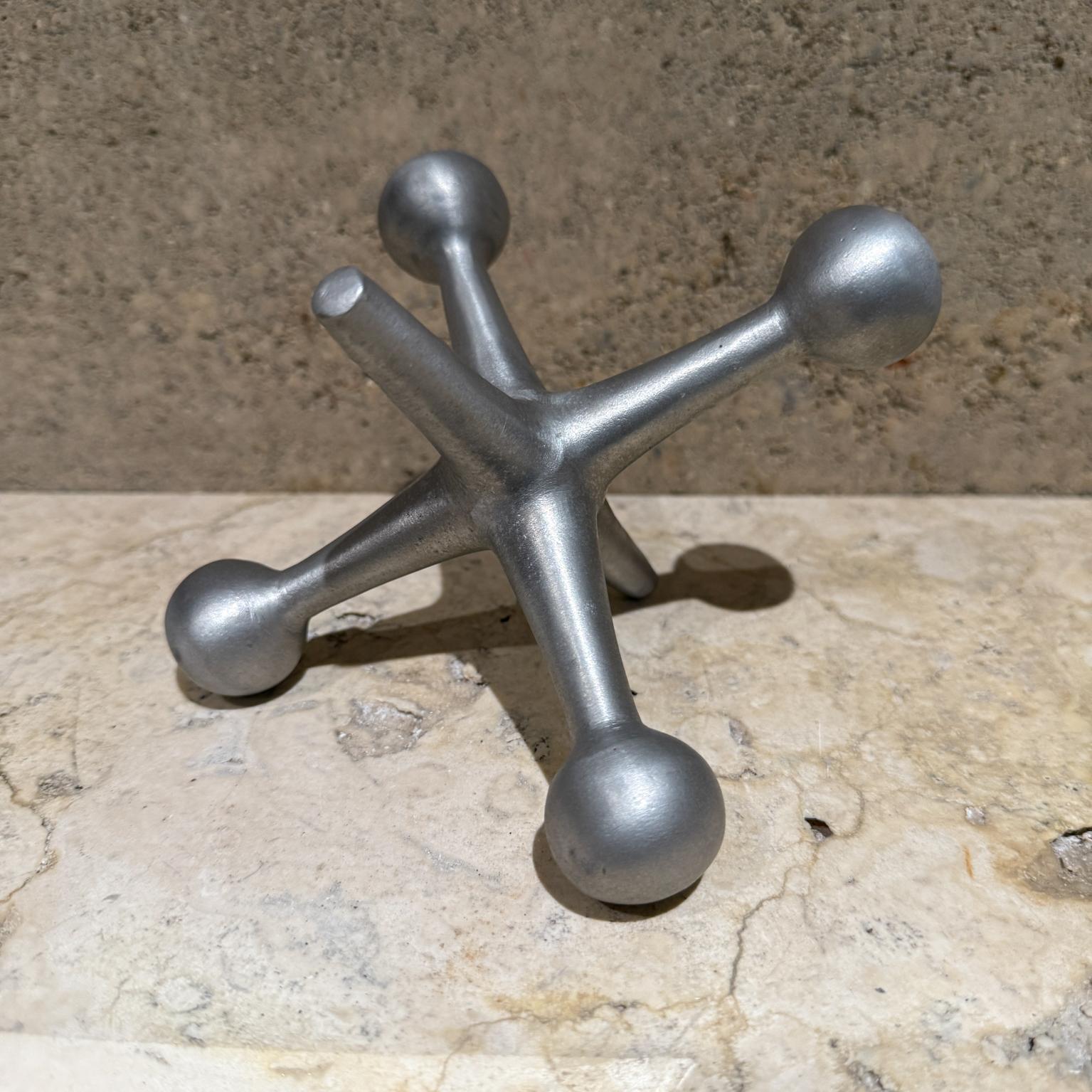 Sculptural Aluminum Jack Jax Bookend 
Style Bill Curry Design Line Calif George Nelson design
unsigned
4 h x 4 d x 5 w
Original preowned condition
Refer to images
