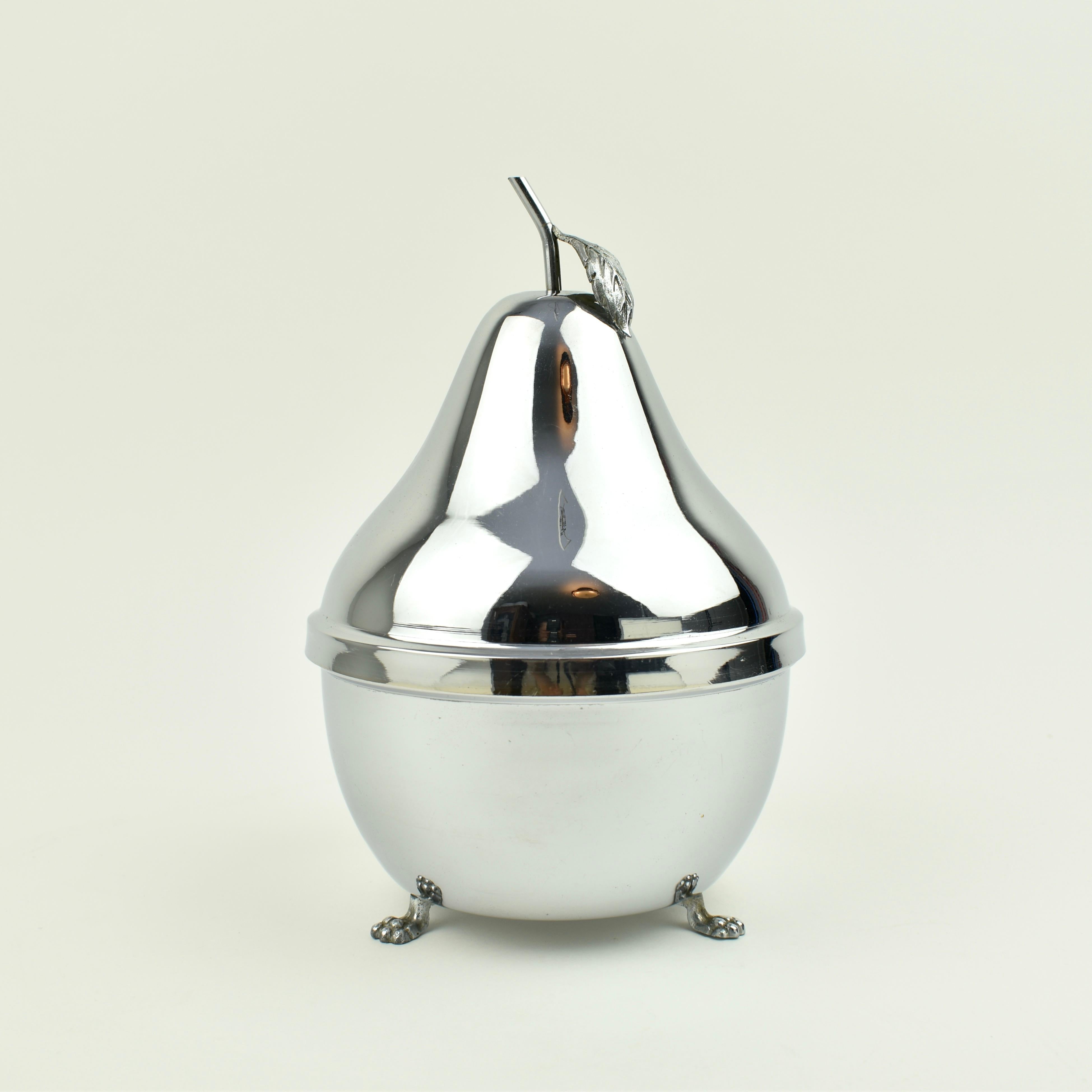 Stunning vintage liquor cabinet in the shape of a Pear. The cabinet has a smoked glass decanter and six glasses inside. The tray that holds the glasses can be removed, so the bucket can be filled with ice. The pink glass has a subtle ribbed