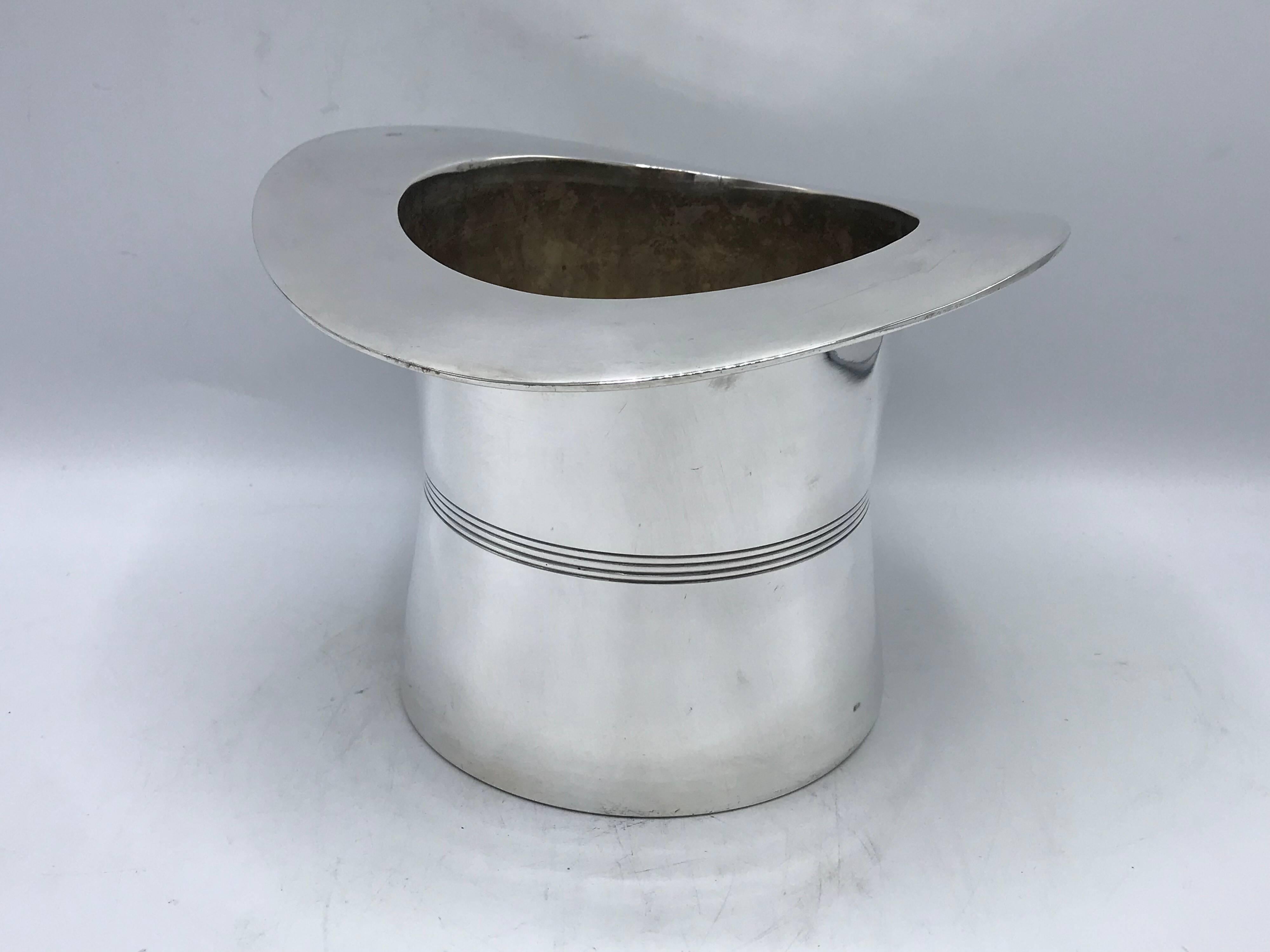 Listed is a stunning, 1960s silver plate top hat wine bottle chiller. The piece could also be used as an ice bucket or cachepot planter. Heavy, weighing nearly 3.5 pounds.