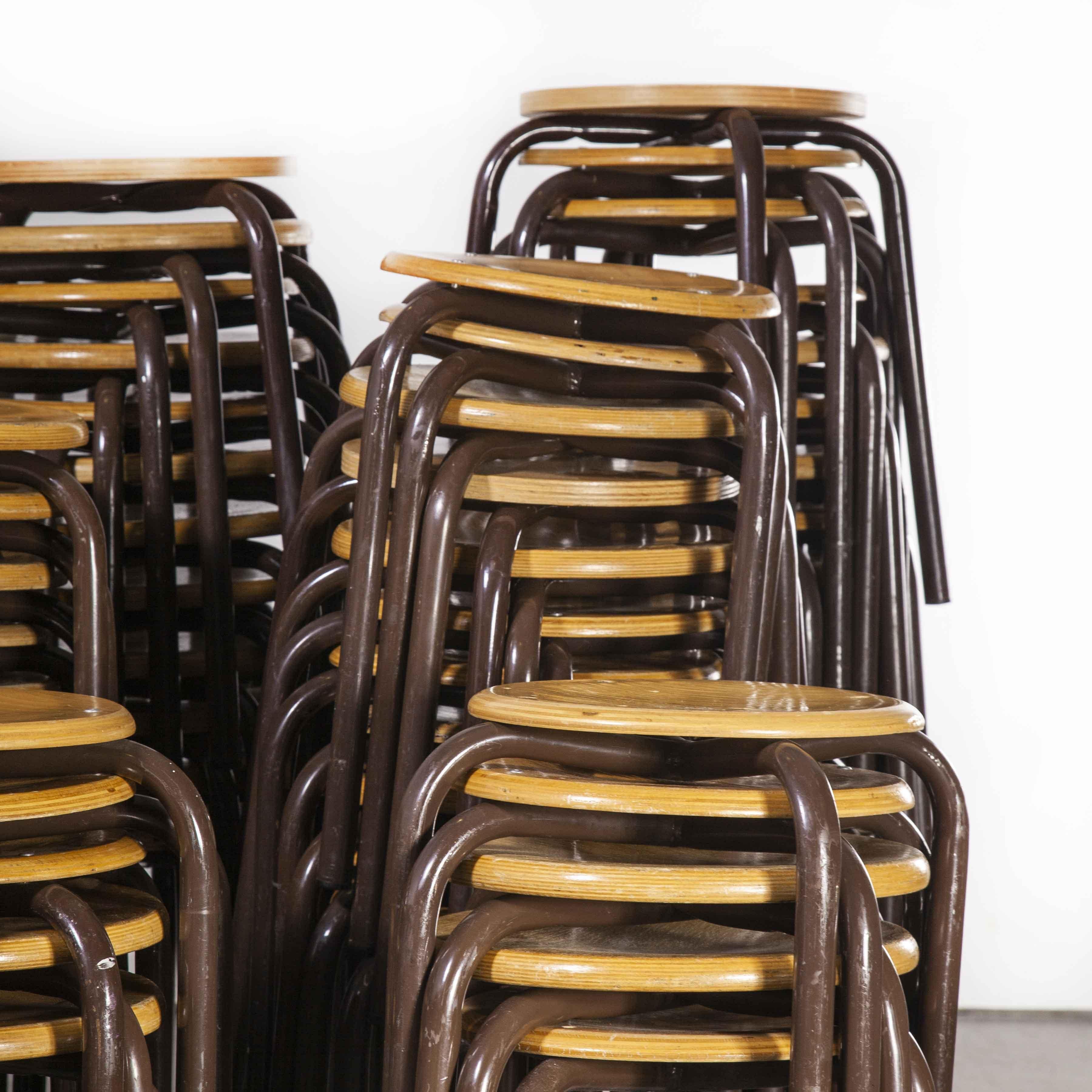 1960's Simple French Stacking School Stools - Brown - Varoious Quantities Available.
1960's Simple French Stacking School Stools - Brown - Varoious Quantities Available. Classic French school stools, solid beech laminated tops with strong metal