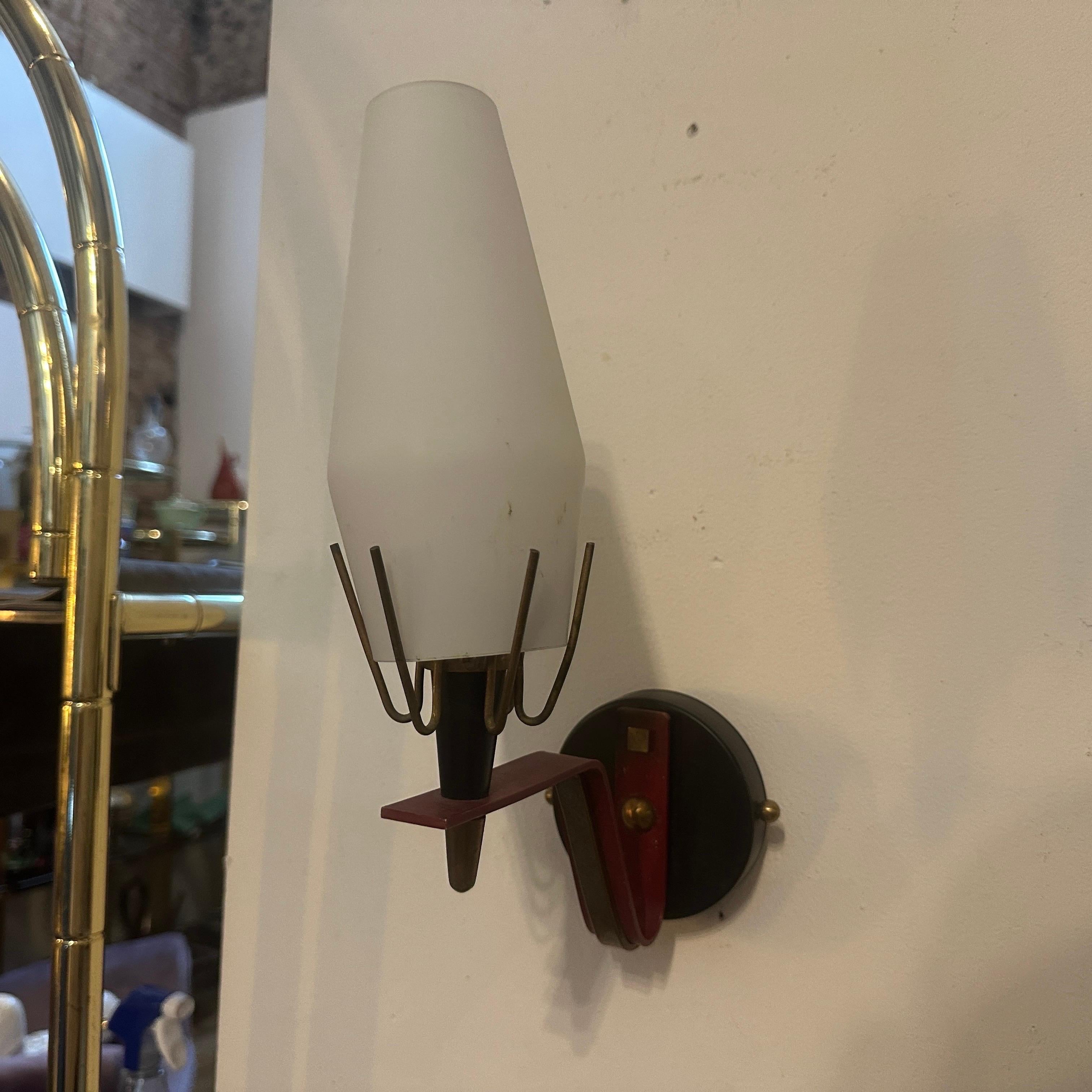 A lot of six wall sconces designed and manufactured in Italy in the Sixties in the manner of Arredoluce, sold one by one. They are in good condition and in working order. Arredoluce was an Italian lighting design company that was prominent during