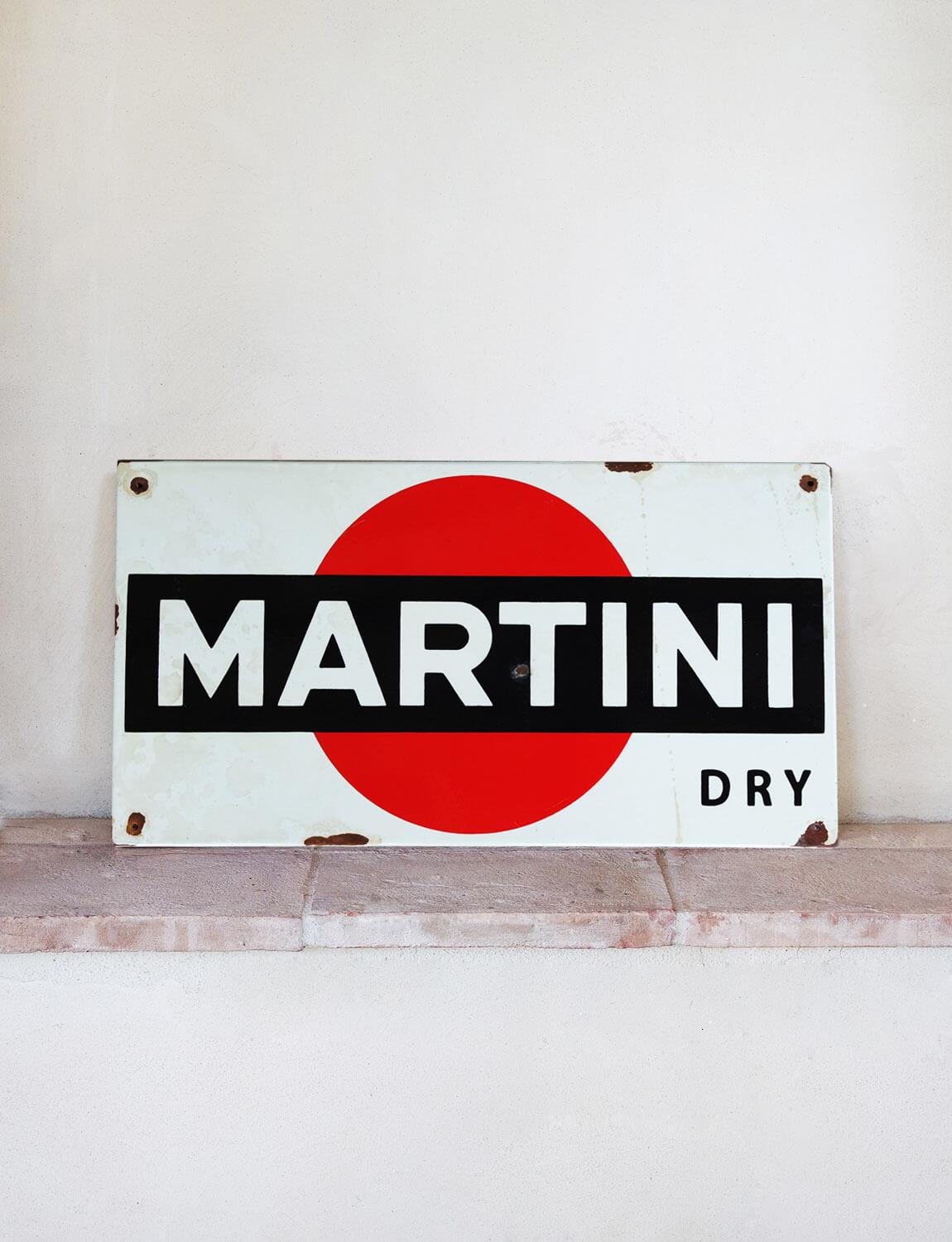 Small 1960s Martini Dry Sign was found in Milan in a bar that was closing down. The original martini sign is made of metal and has a painted enamelled finish. These signs were prevalent in bars in Italy in the 1950s, 1960s and 1970s. They now make