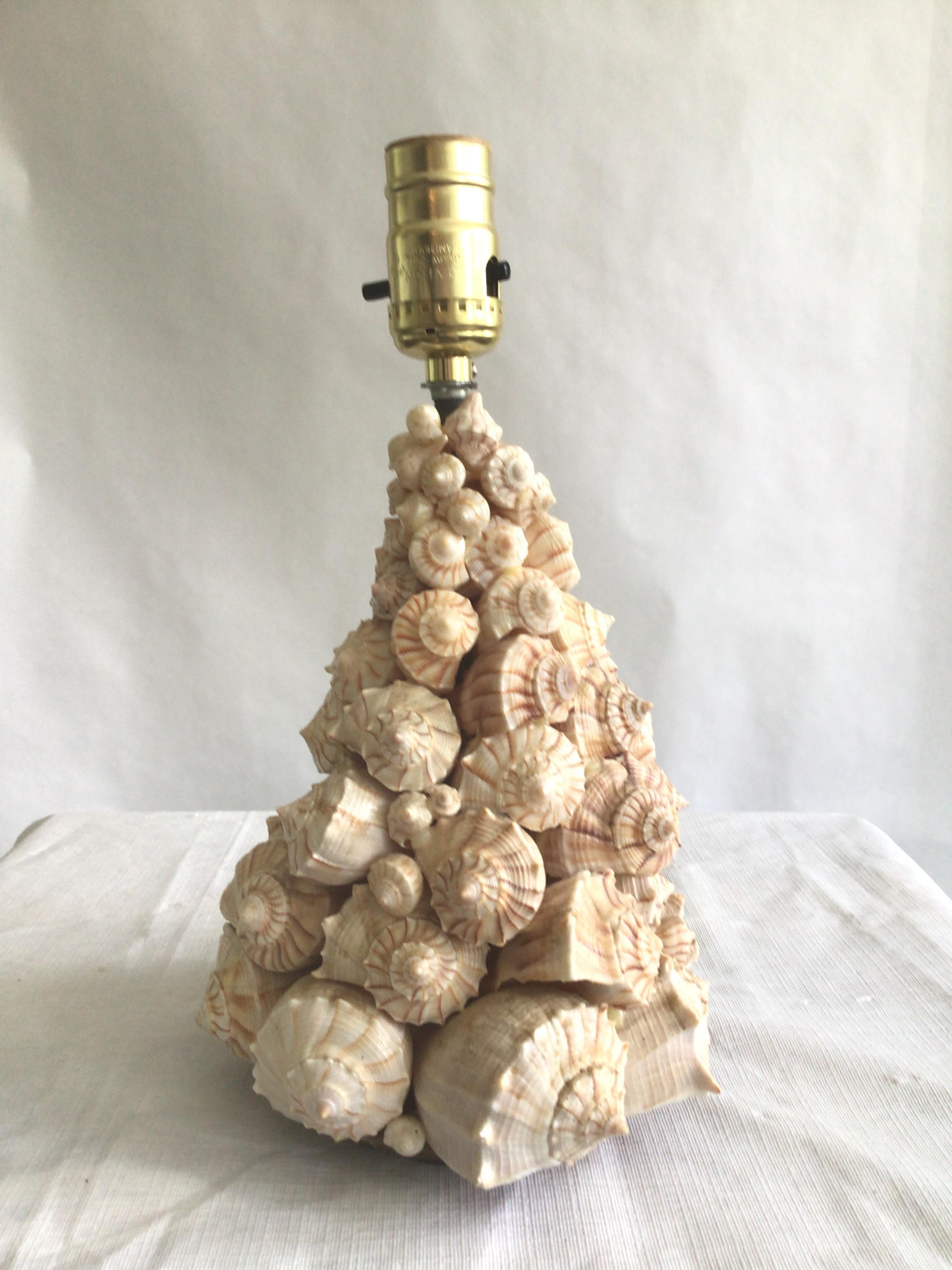 1960s Small Shell Table Lamp
Made of natural small conch shells
Nautical or perfect for a tropical beach house 
This small table lamp would look stunning on a bar countertop 
Height to Top of Socket
Needs Rewiring