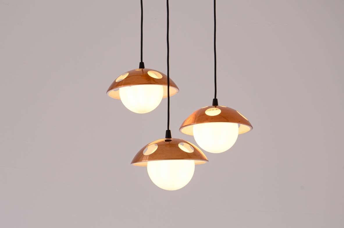 Italian 1960's Small three-light chandelier with perforated copper shades For Sale