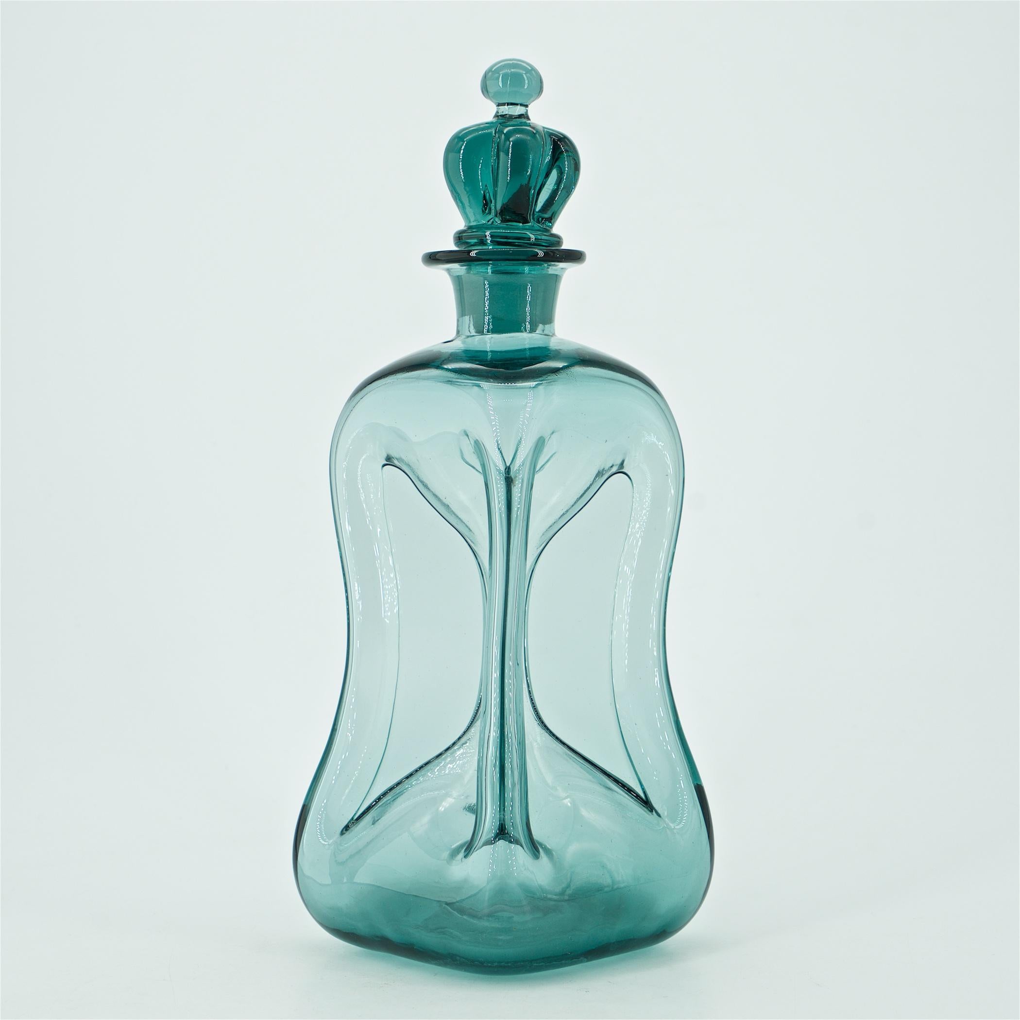 Liquid will fill into the edges of the pinched form, really beautiful design element. This Holmegaard smoke grey decanter was handmade, mouth-blown high quality art glass, with ground pontil mark on the bottom and rare original royal crown stopper,