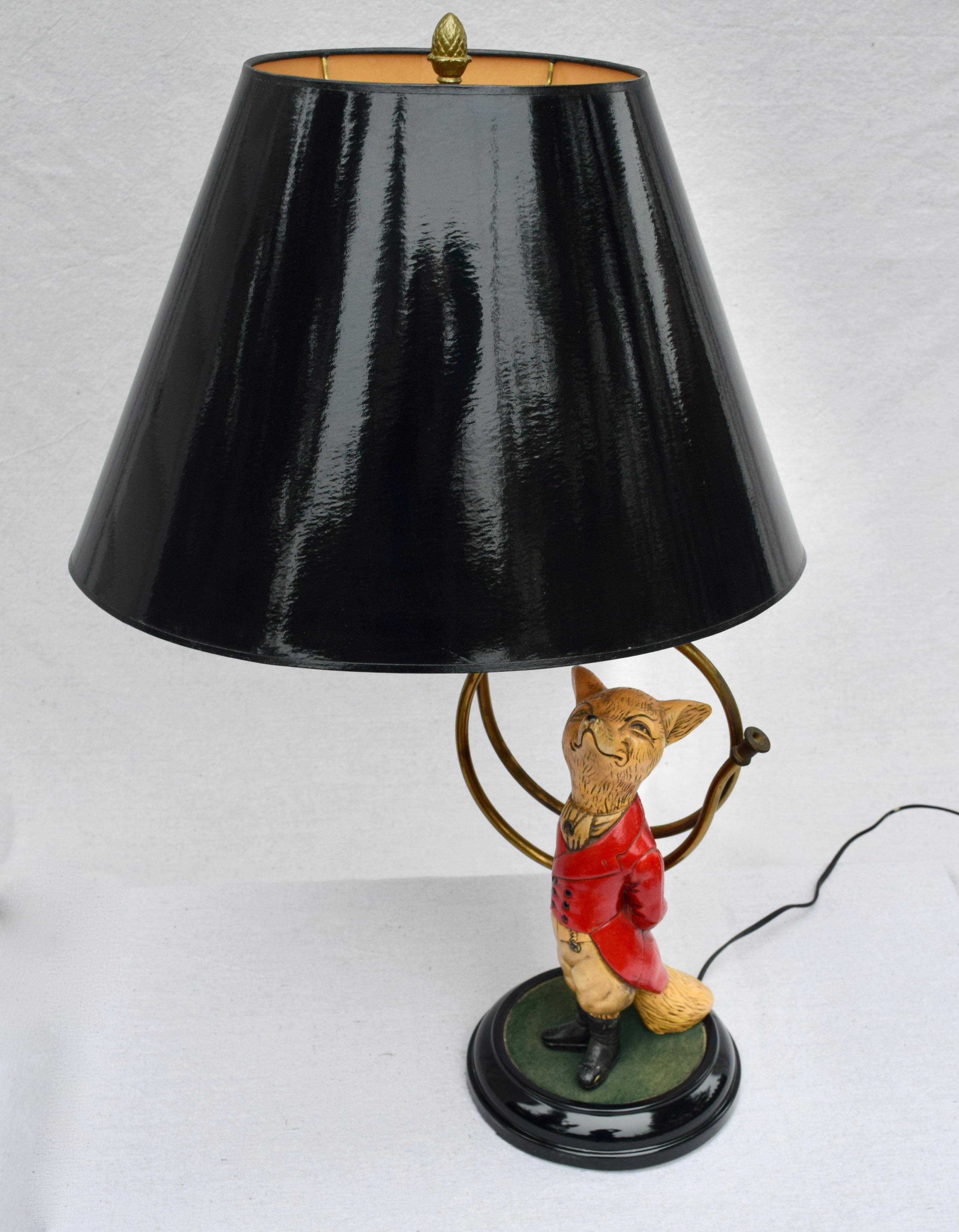 Scarcely seen vintage snooty fox brass French horn English fox hunting table lamp with black lacquered parchment shade included. Original wiring in fine working condition, circa 1960s, USA.